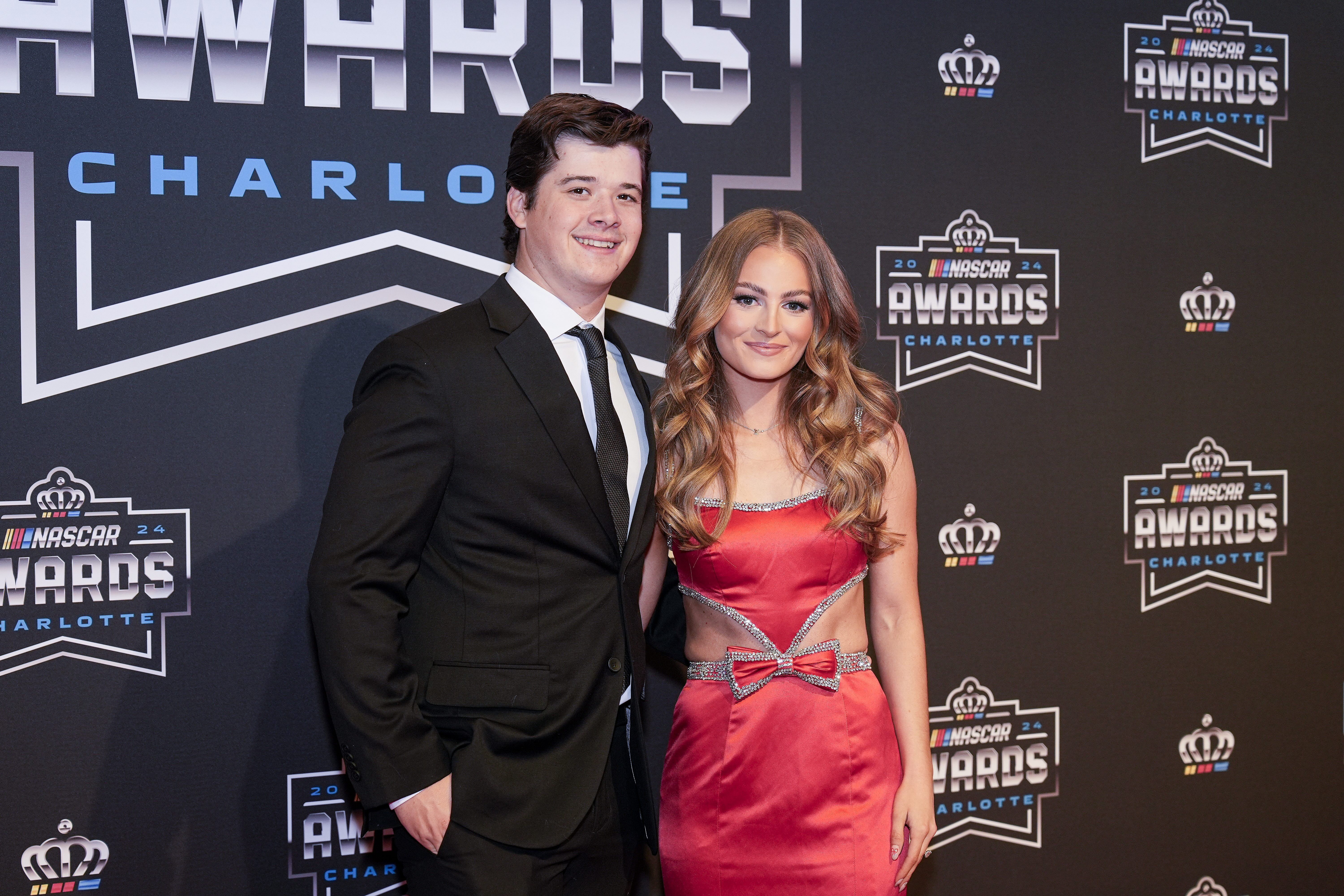 Nov 22, 2024; Charlotte, NC, USA; NASCAR Cup Series driver Harrison Burton and fianc&eacute; Jenna Petty during the NASCAR Awards Banquet at Charlotte Convention Center. Mandatory Credit: Jim Dedmon-Imagn Images - Source: Imagn