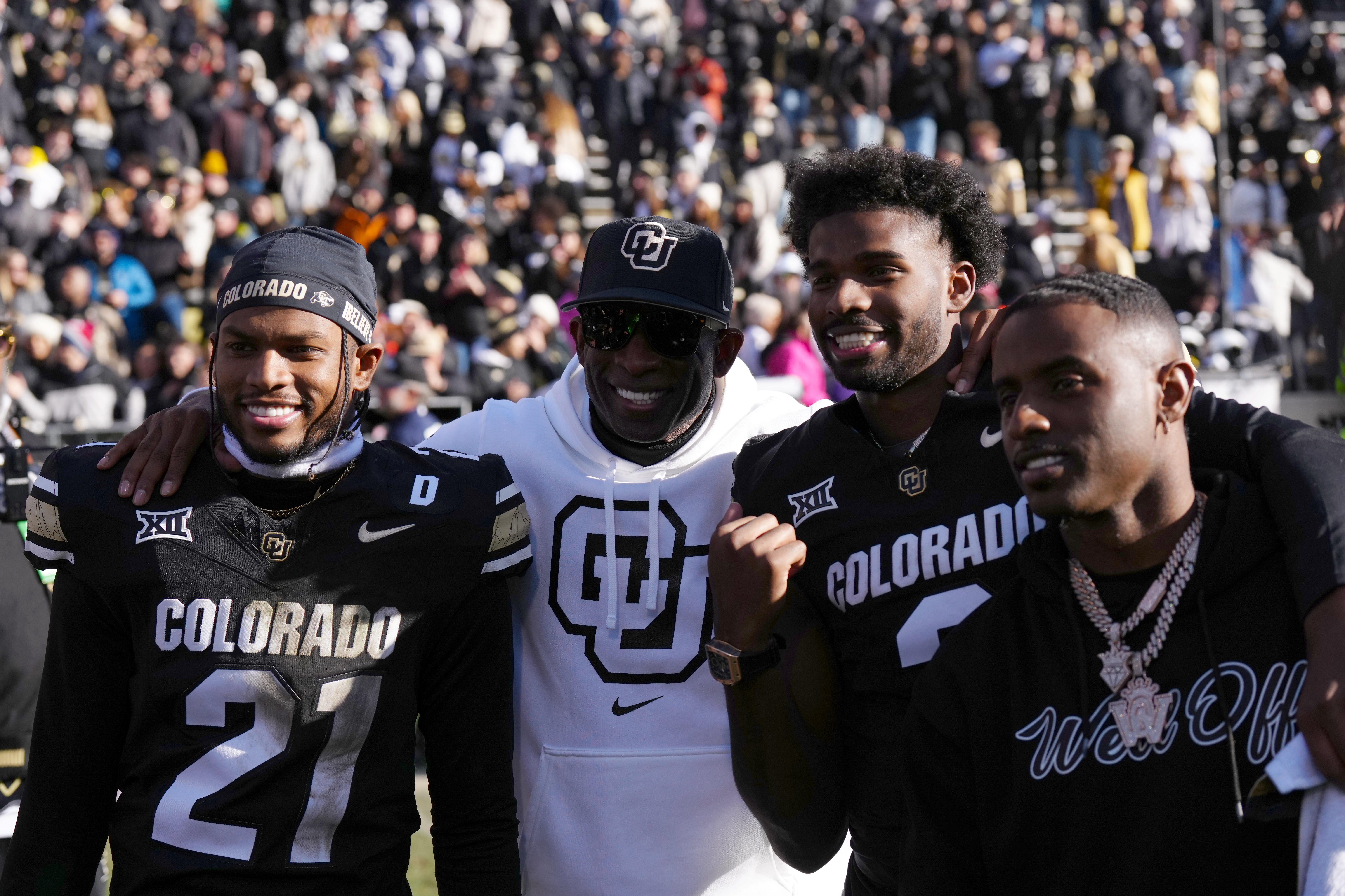 Colorado Buffaloes safety Shilo Sanders (21), quarterback Shedeur Sanders (2), coach Deion Sanders and social media producer Deion Sanders Jr. - Source: Imagn