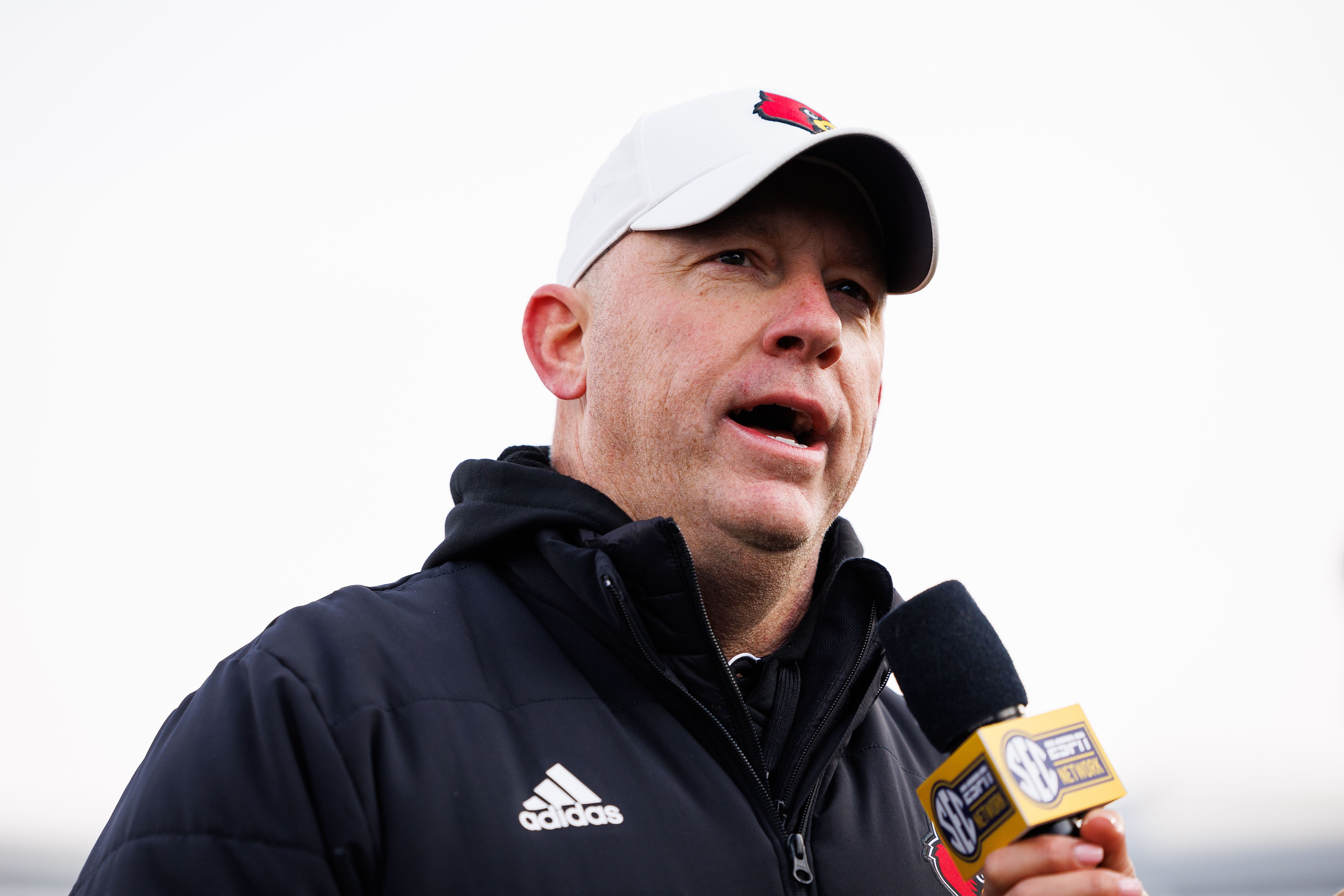 Nov 30, 2024; Lexington, Kentucky, USA; Louisville Cardinals head coach Jeff Brohm is interviewed after the game against the Kentucky Wildcats at Kroger Field. Mandatory Credit: Jordan Prather-Imagn Images - Source: Imagn