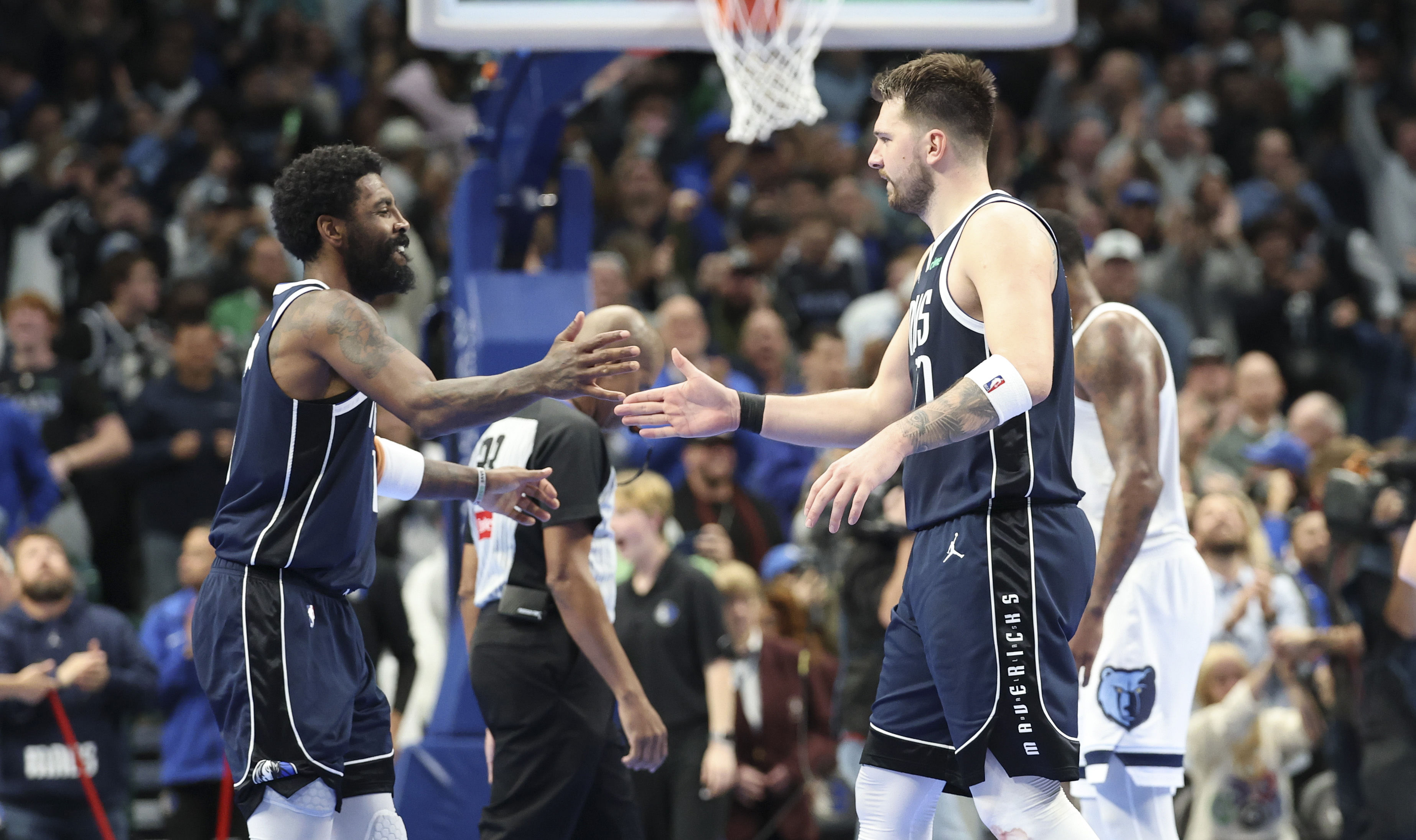 Kyrie Irving (11) celebrates with Luka Doncic (77) - Source: Imagn