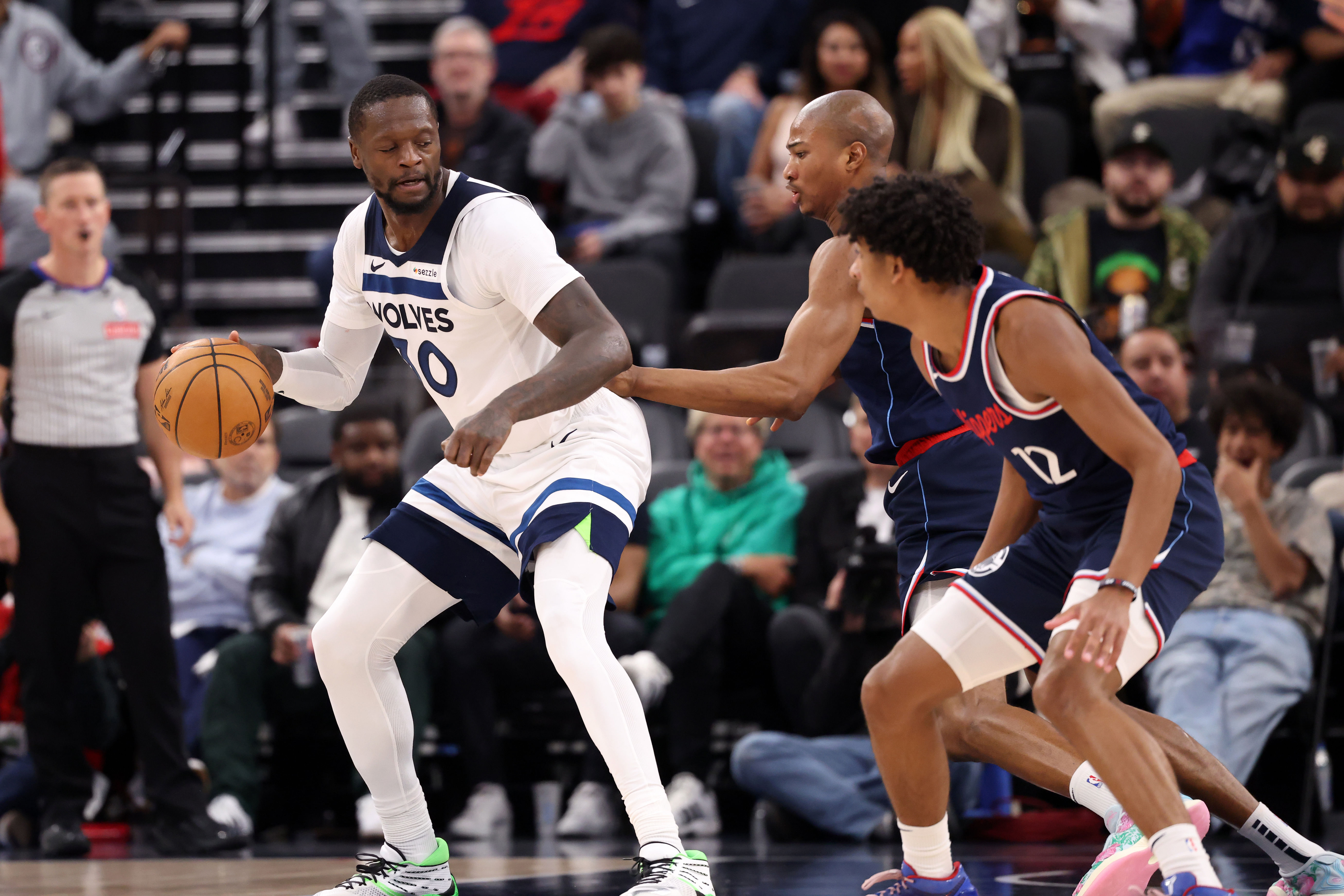 Minnesota Timberwolves forward Julius Randle is double-teamed against the LA Clippers at the Intuit Dome. Photo Credit: Imagn