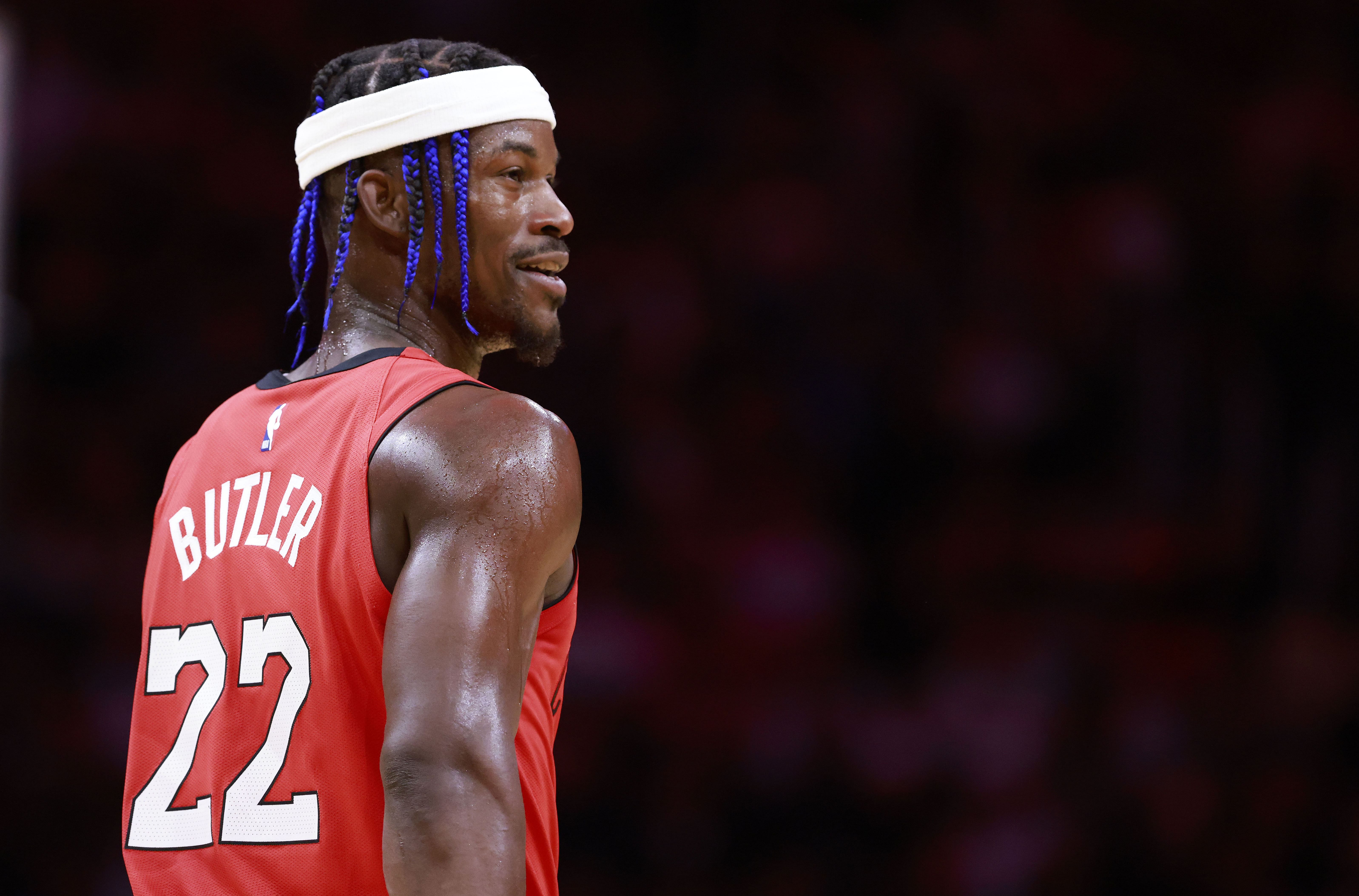 Miami Heat forward Jimmy Butler smiles at the bench against the Cleveland Cavaliers at Kaseya Center. Photo Credit: Imagn