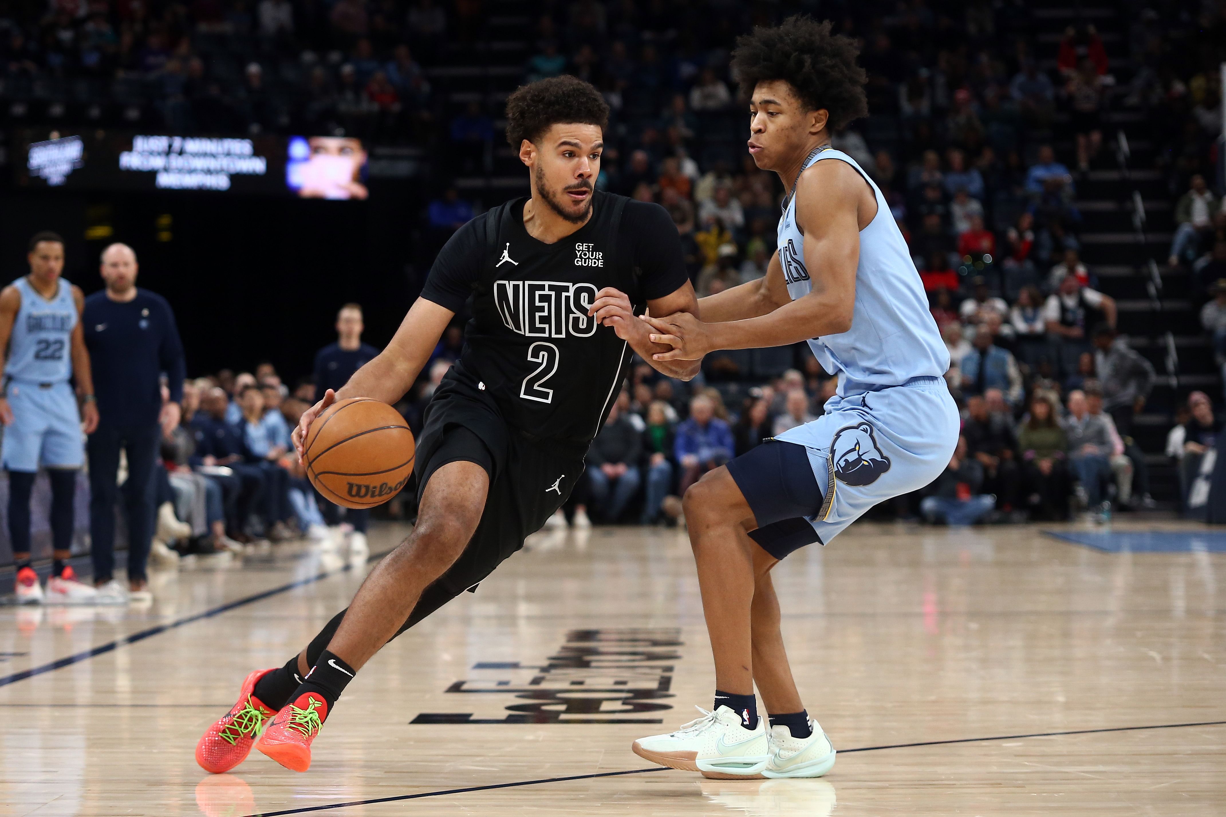 Brooklyn Nets forward Cameron Johnson drives to the basket as Memphis Grizzlies forward Jaylen Wells defends at FedExForum. Photo Credit: Imagn