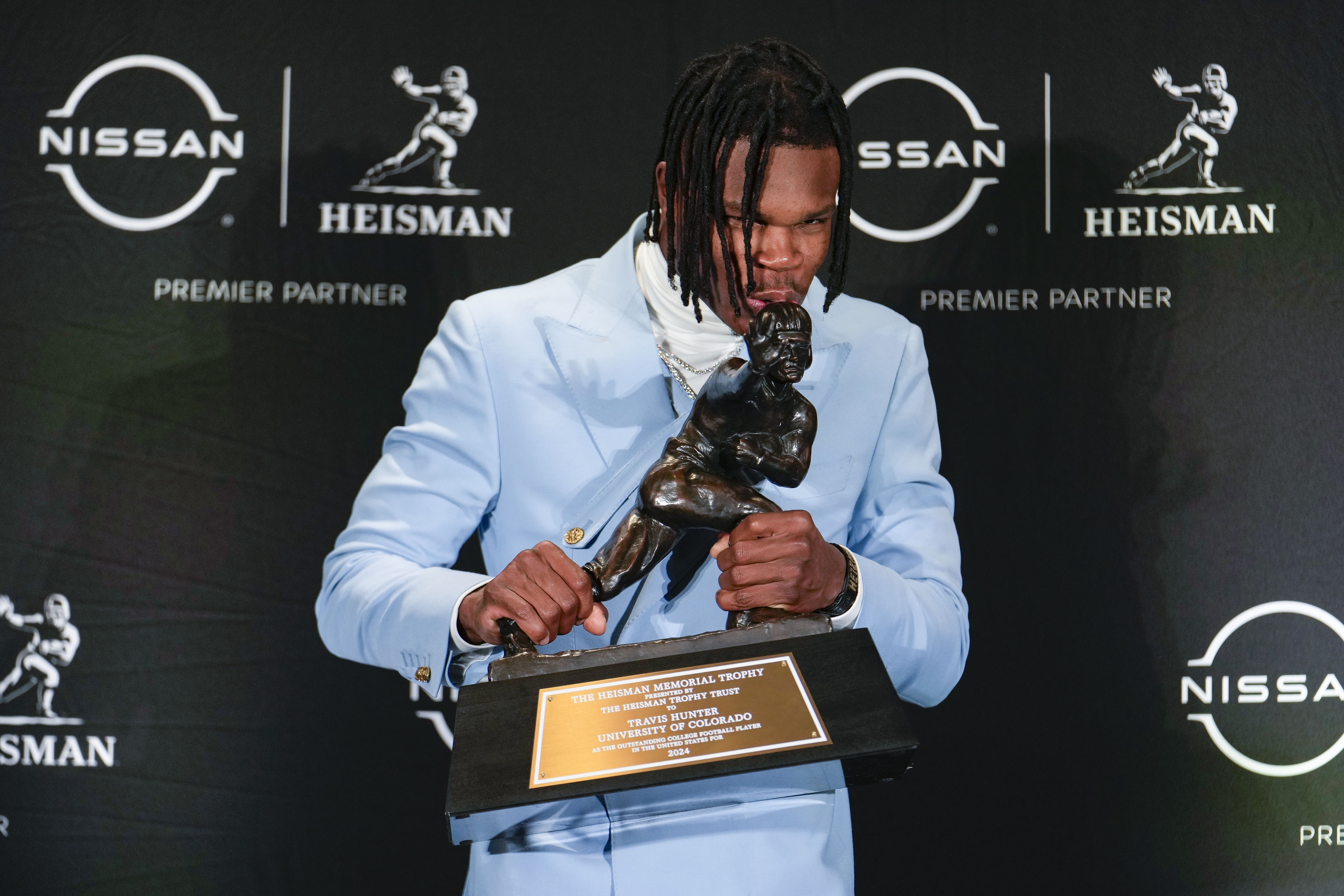 NCAA Football: Travis Hunter with his Heisman Trophy - Source: Imagn