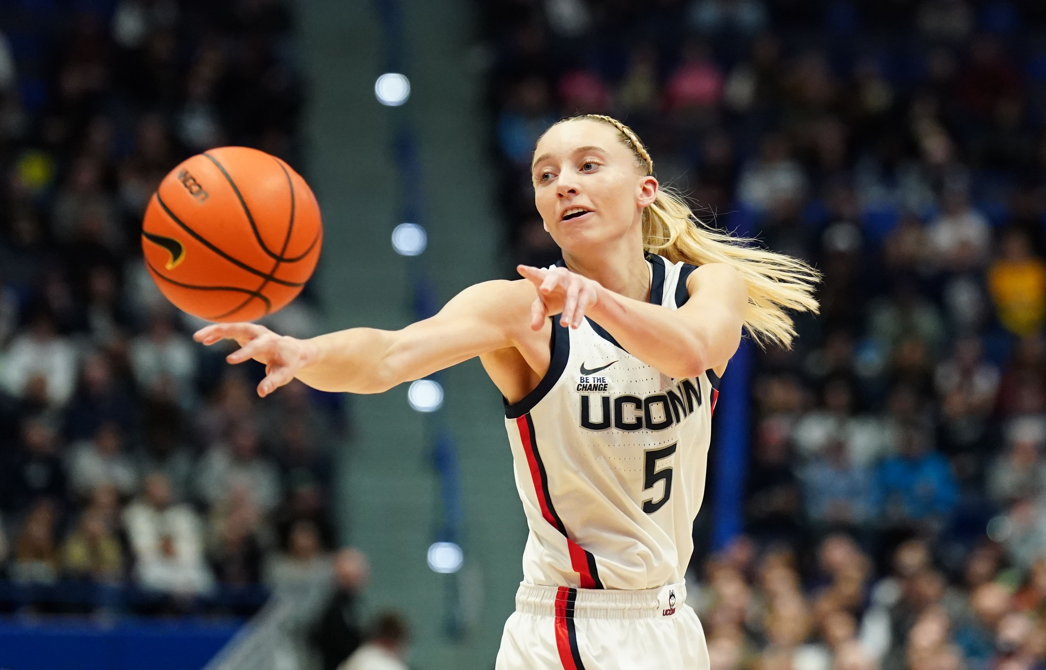 UConn Huskies guard Paige Bueckers (5) passes the ball in the first half of their game against the Georgetown Hoyas at XL Center. Photo: Imagn