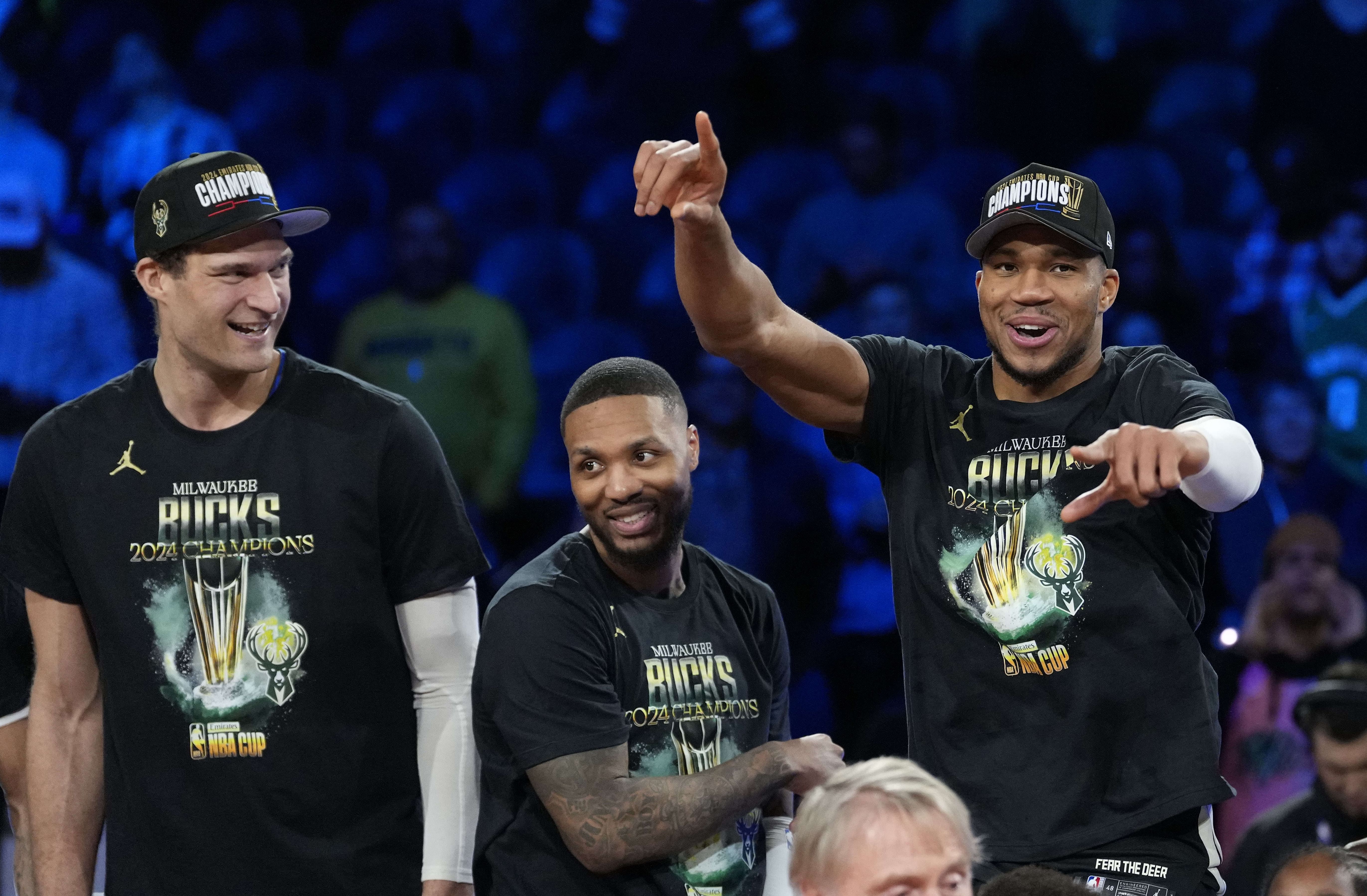 Milwaukee Bucks&#039; Brook Lopez, Damian Lillard and Giannis Antetokounmpo celebrate after winning the Emirates NBA Cup at T-Mobile Arena. Photo Credit: Imagn