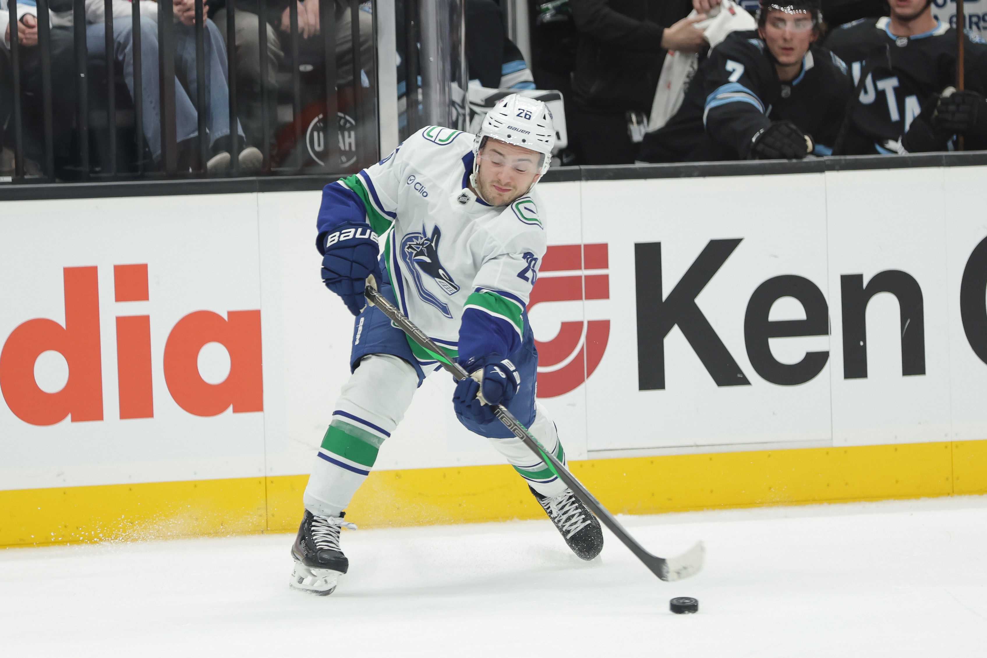 Vancouver Canucks defenseman Erik Brannstrom (26) shoots the puck during an NHL game against Utah. - (Credits: IMAGN)