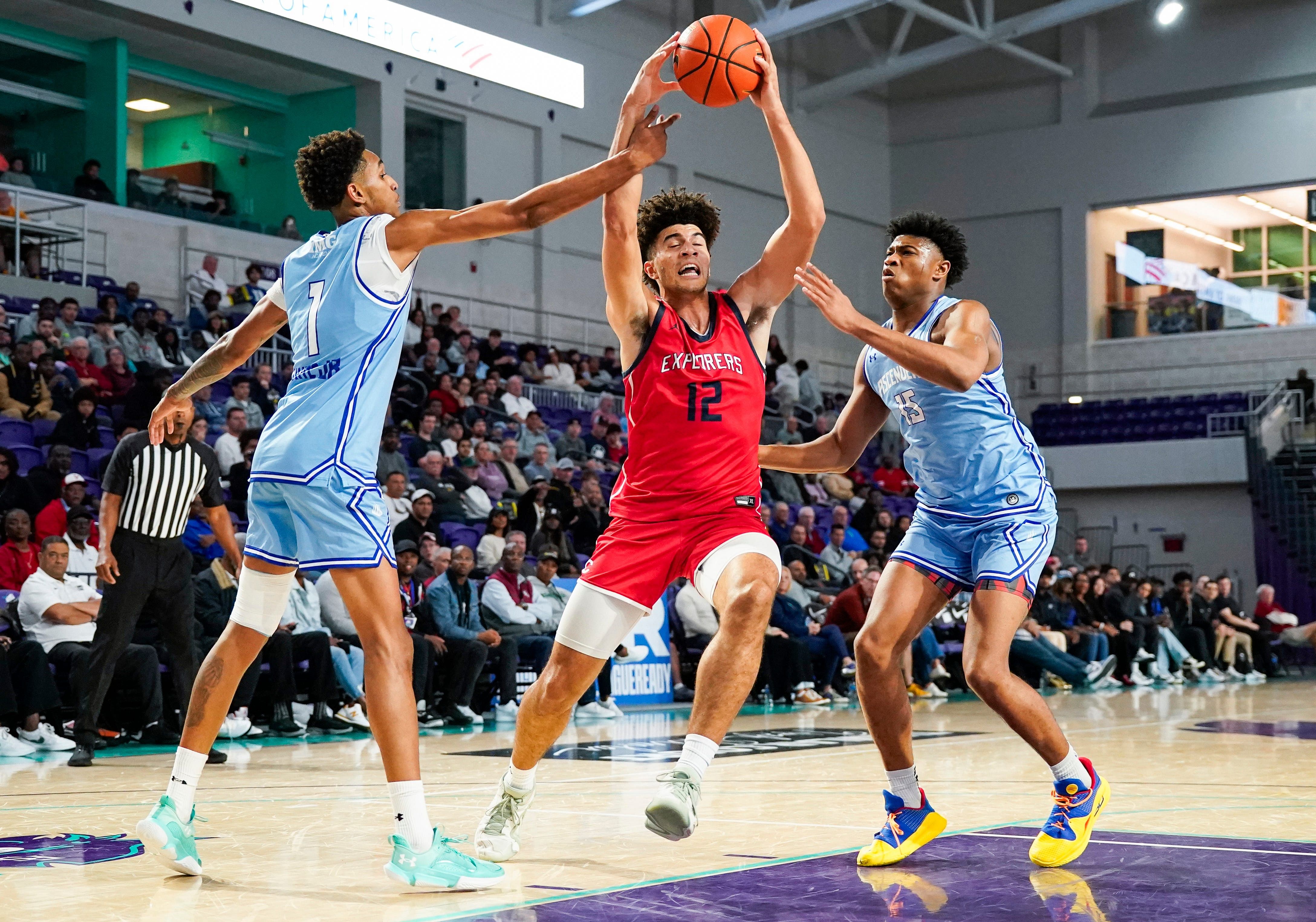 Columbus Explorers forward Cameron Boozer (12) is fouled by IMG Academy Ascenders forward Sadiq White Jr. (1) during the first quarter of the City of Palms Classic semifinal game at Suncoast Credit Union Arena in Fort Myers, Fla., on Saturday, Dec. 21, 2024. - Source: Imagn