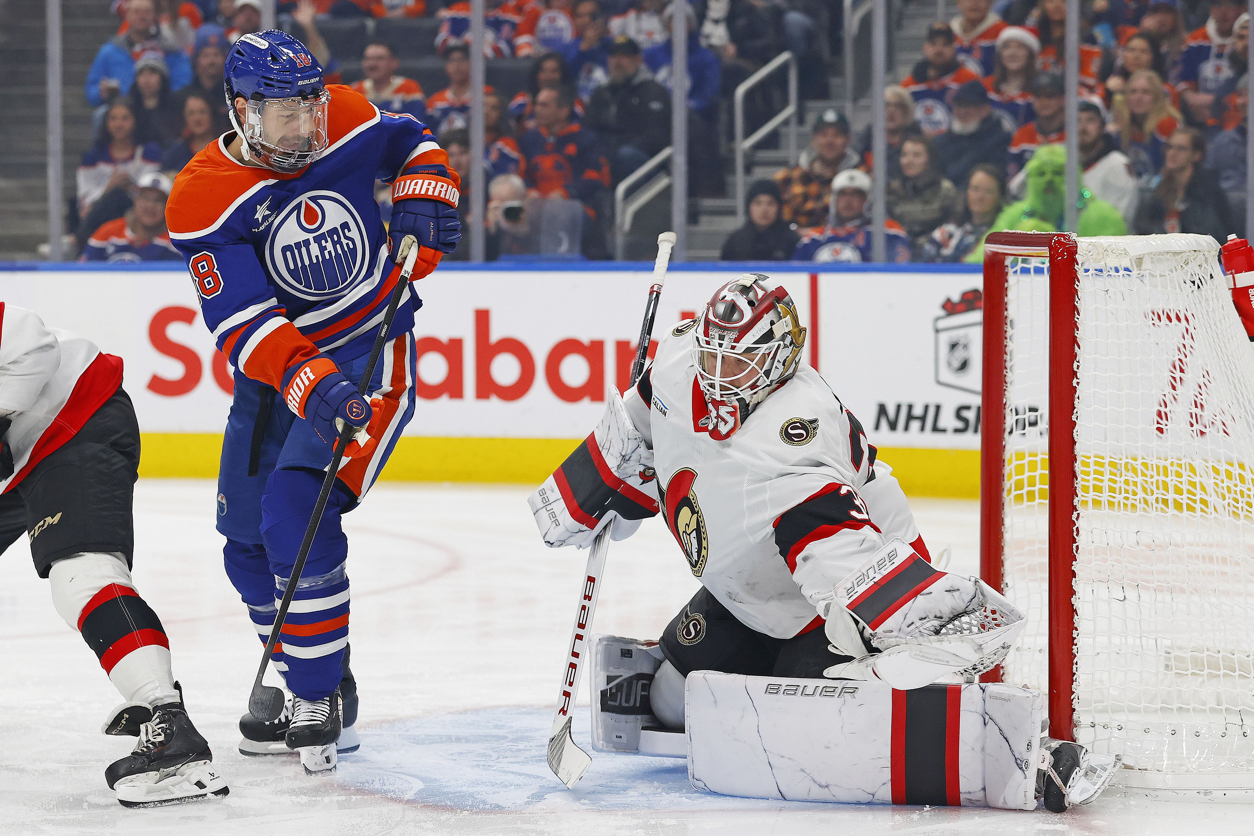 Ottawa Senators goaltender Linus Ullmark (35) makes a save against Calgary Flames left wing Jakob Pelletier (22). (Credits: IMAGN)