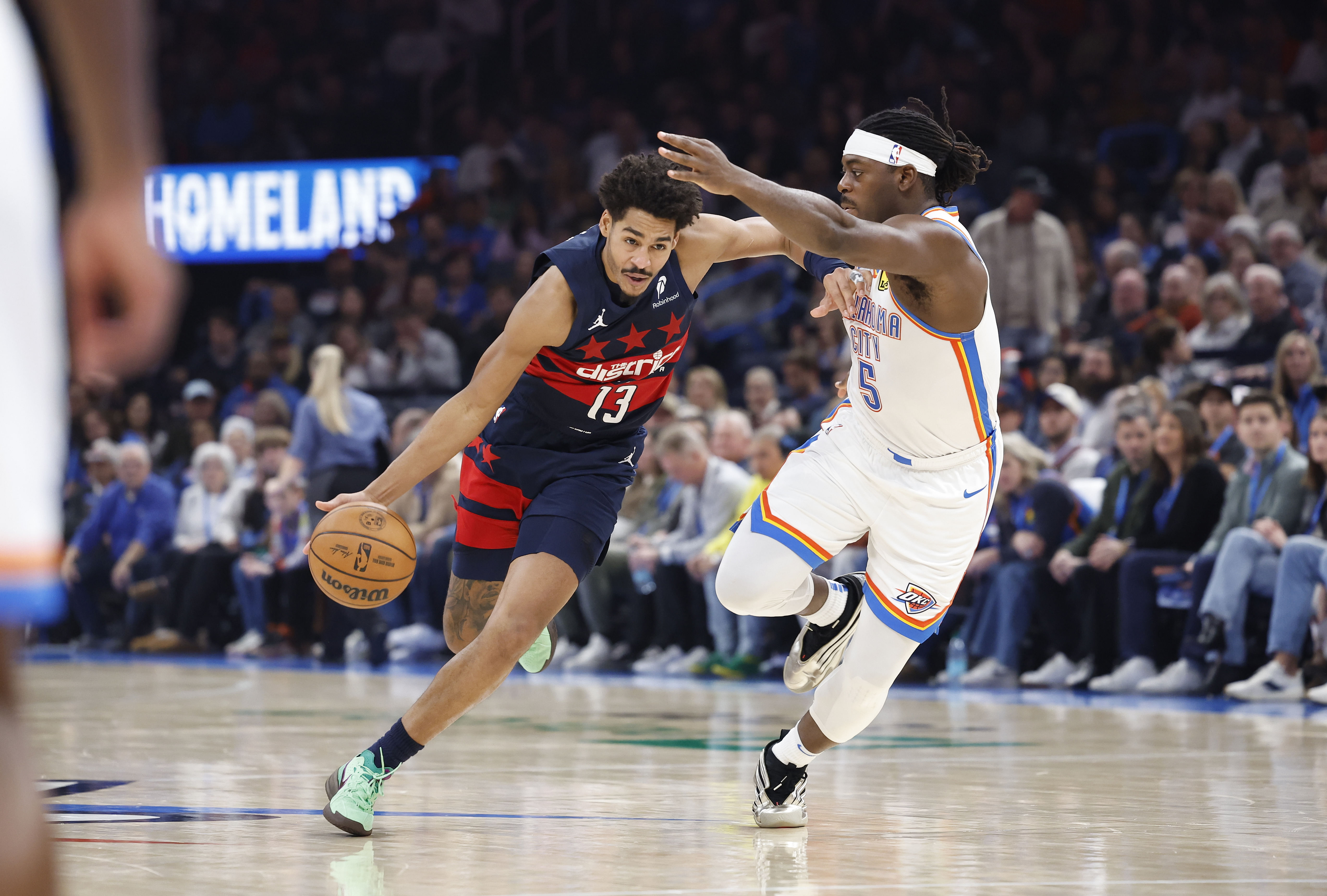 Washington Wizards guard Jordan Poole drives down the court beside OKC Thunder guard Luguentz Dort at Paycom Center. Photo Credit: Imagn