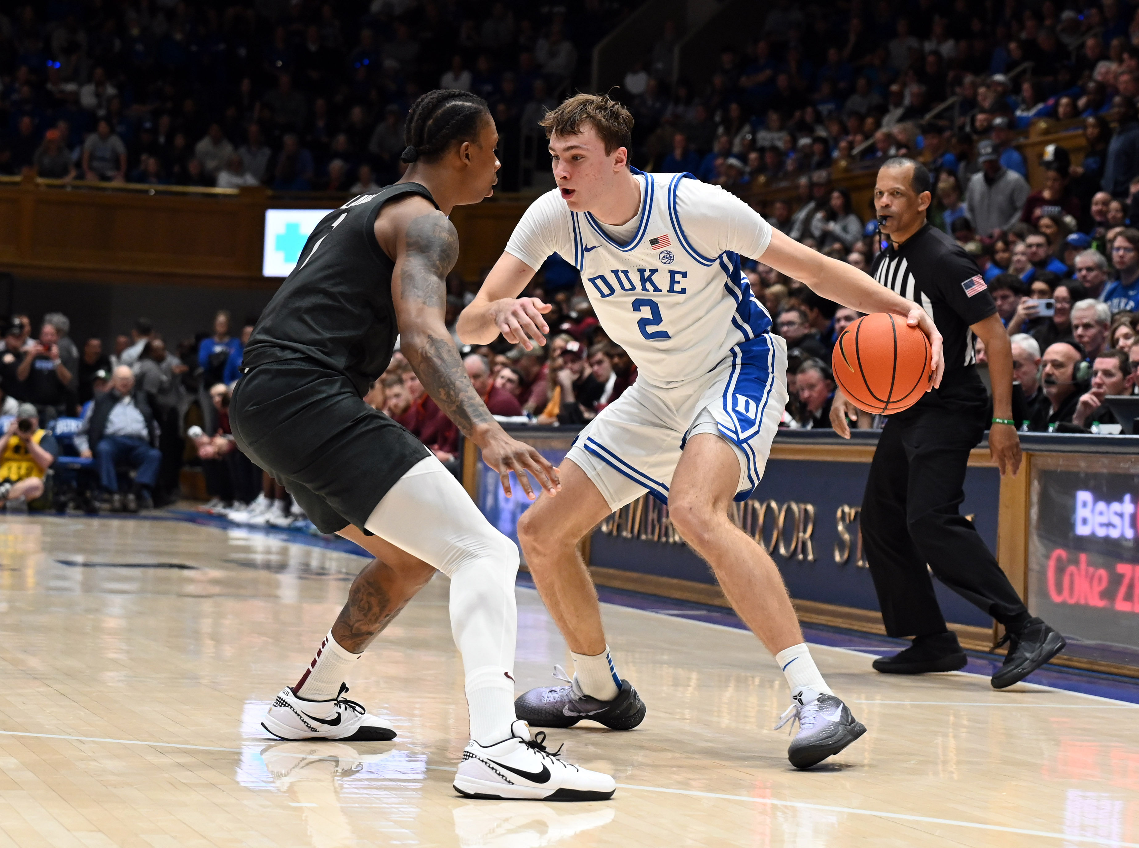 Duke Blue Devils forward Cooper Flagg (#2) controls the ball in front of Virginia Tech Hokies forward Tobi Lawal (#1) during the second half at Cameron Indoor Stadium. Photo: Imagn