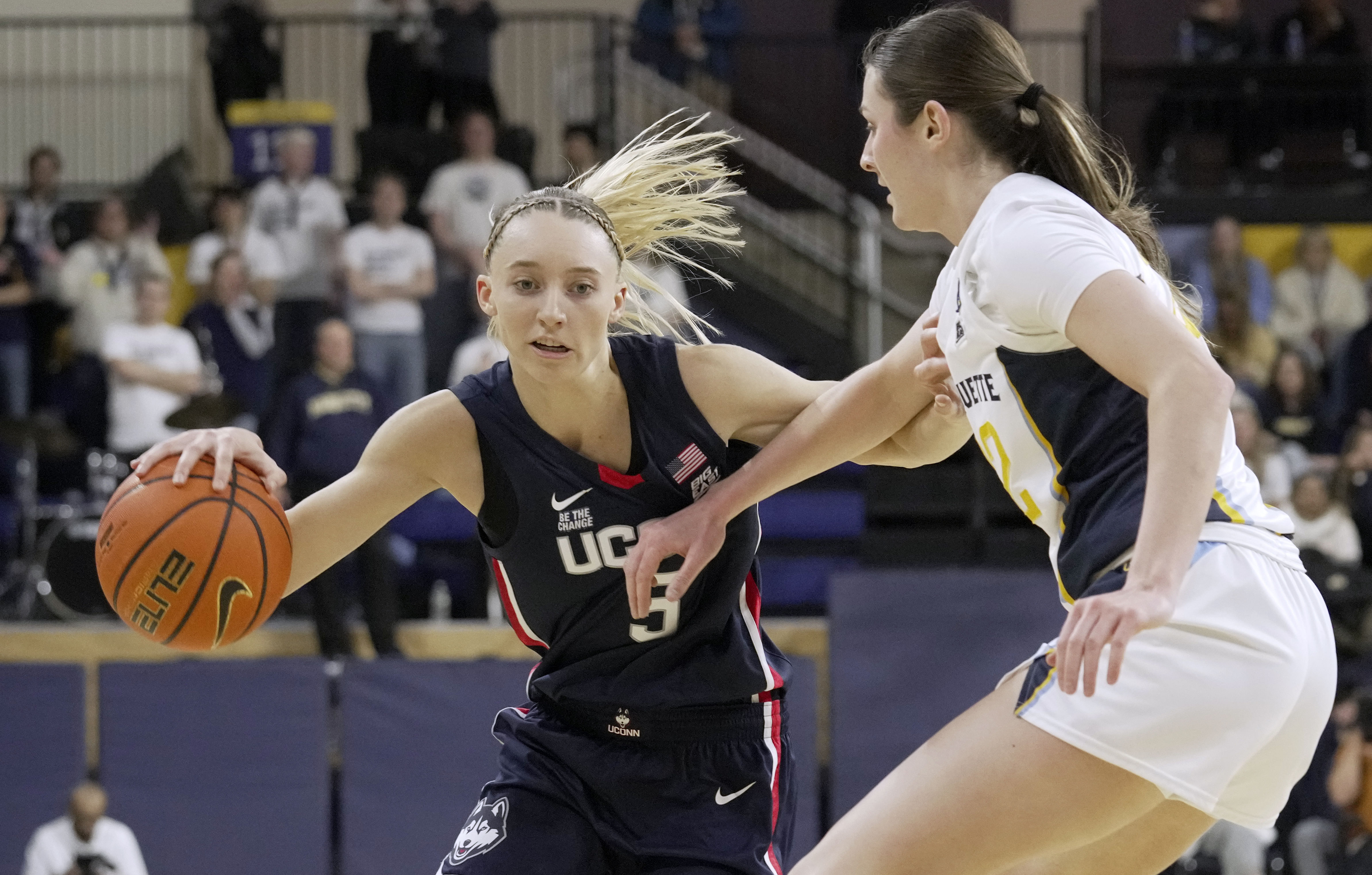 UConn Huskies guard Paige Bueckers (#5) attacks the defense of Marquette guard Halle Vice (#22) during the first half of their NCAA game on January 1, 2025 at the Al McGuire Center in Milwaukee, Wisconsin. Photo: Imagn