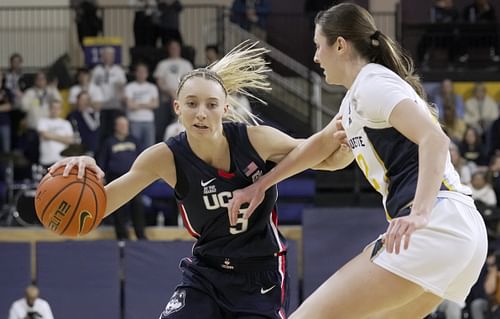 UConn Huskies guard Paige Bueckers (#5) attacks the defense of Marquette guard Halle Vice (#22) during the first half of their NCAA game on January 1, 2025 at the Al McGuire Center in Milwaukee, Wisconsin. Photo: Imagn