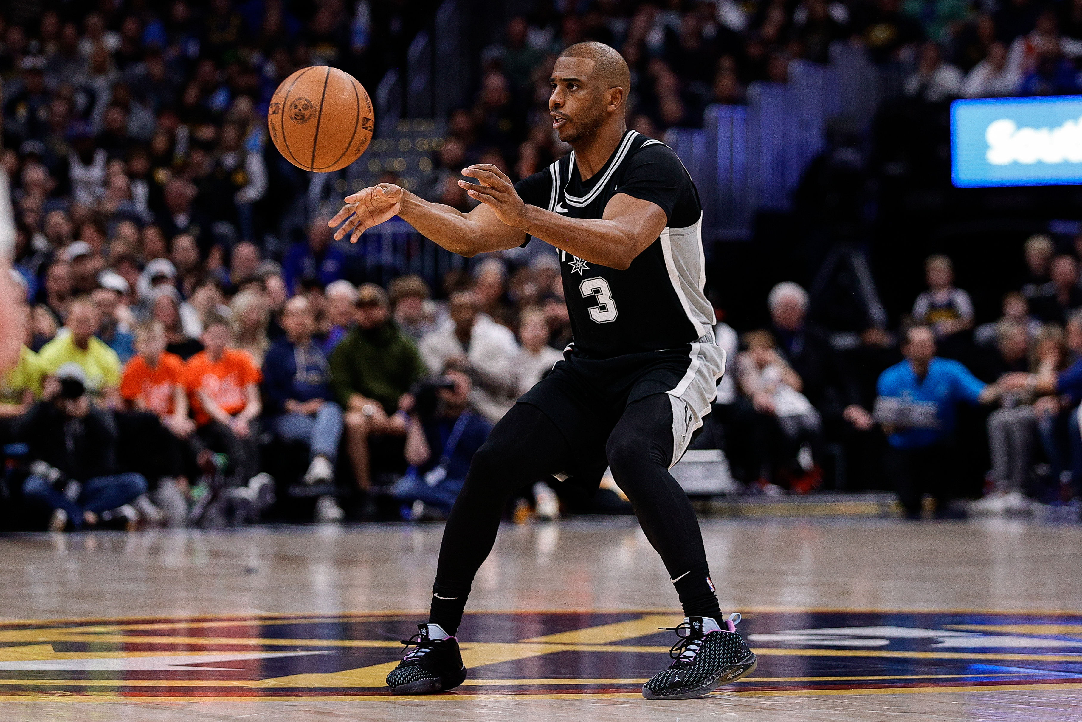 Jan 3, 2025; Denver, Colorado, USA; San Antonio Spurs guard Chris Paul (3) passes the ball in the second quarter against the Denver Nuggets at Ball Arena. Mandatory Credit: Isaiah J. Downing-Imagn Images - Source: Imagn