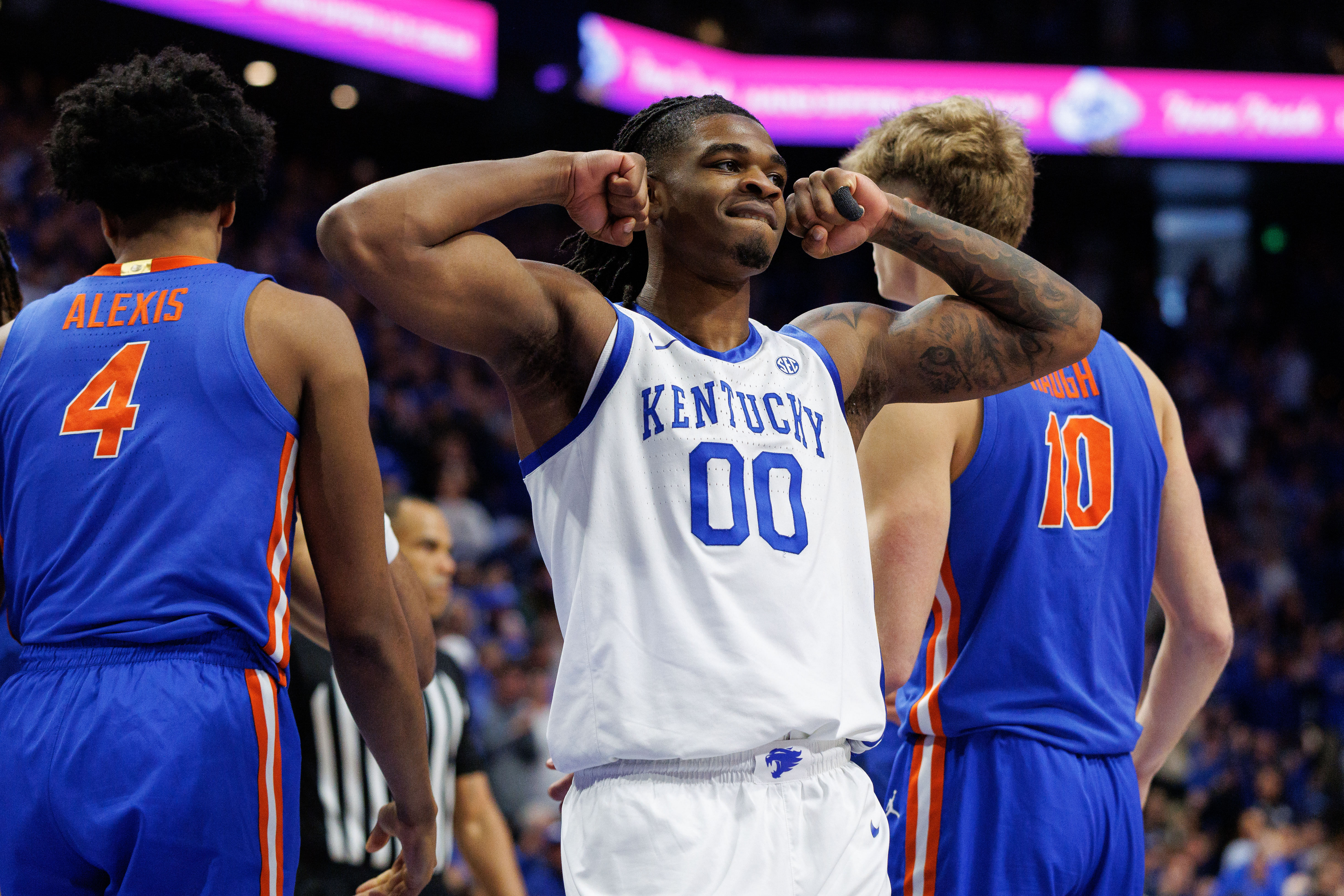 Kentucky Wildcats guard Otega Oweh (#00) celebrates a basket by center Amari Williams during the second half against the Florida Gators at Rupp Arena. Photo: Imagn