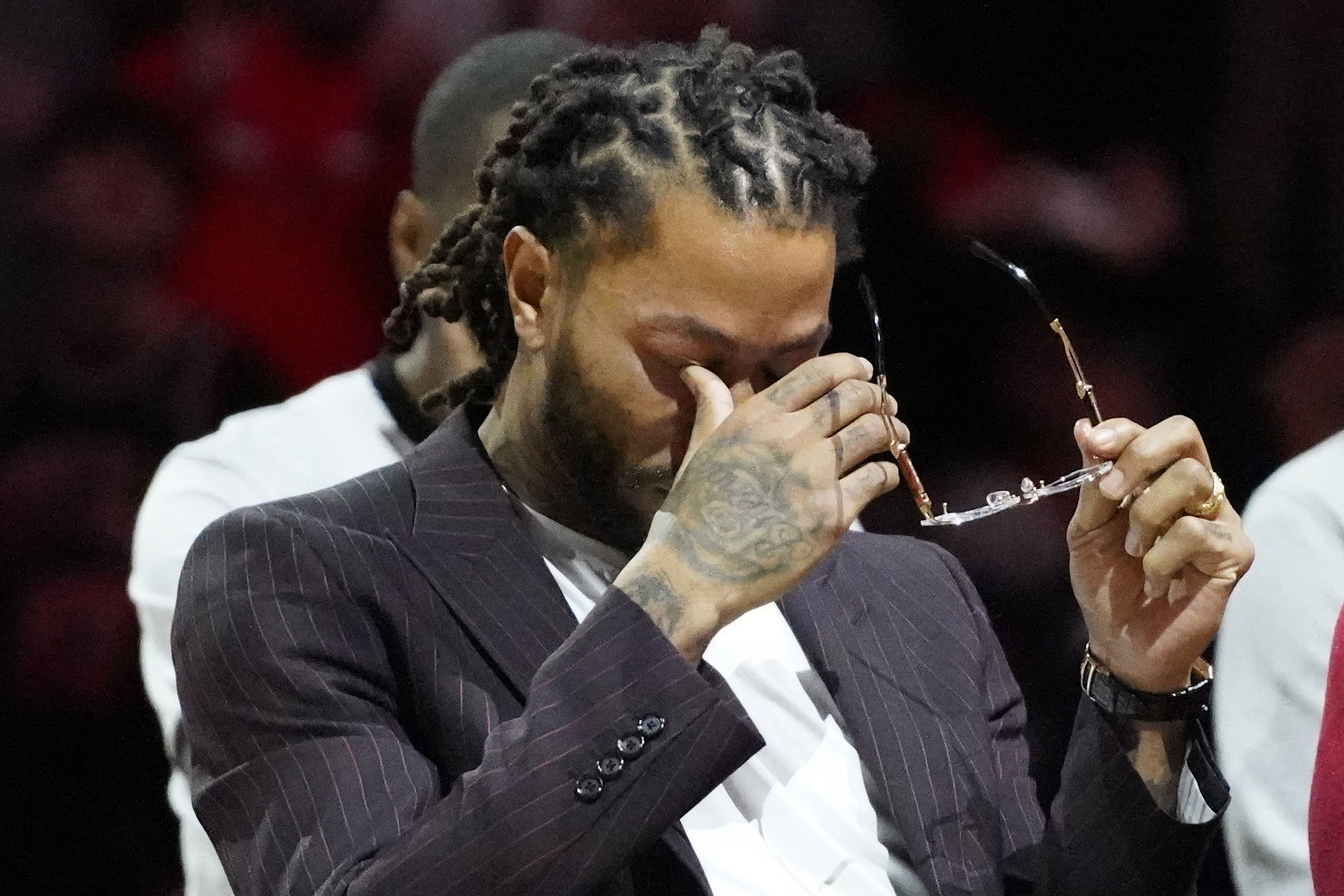 Jan 4, 2025; Chicago, Illinois, USA; Chicago Bulls and New York Knicks former player Derrick Rose reacts as he is honored at halftime of a game between the Chicago Bulls and the New York Knicks at United Center. Mandatory Credit: David Banks-Imagn Images - Source: Imagn