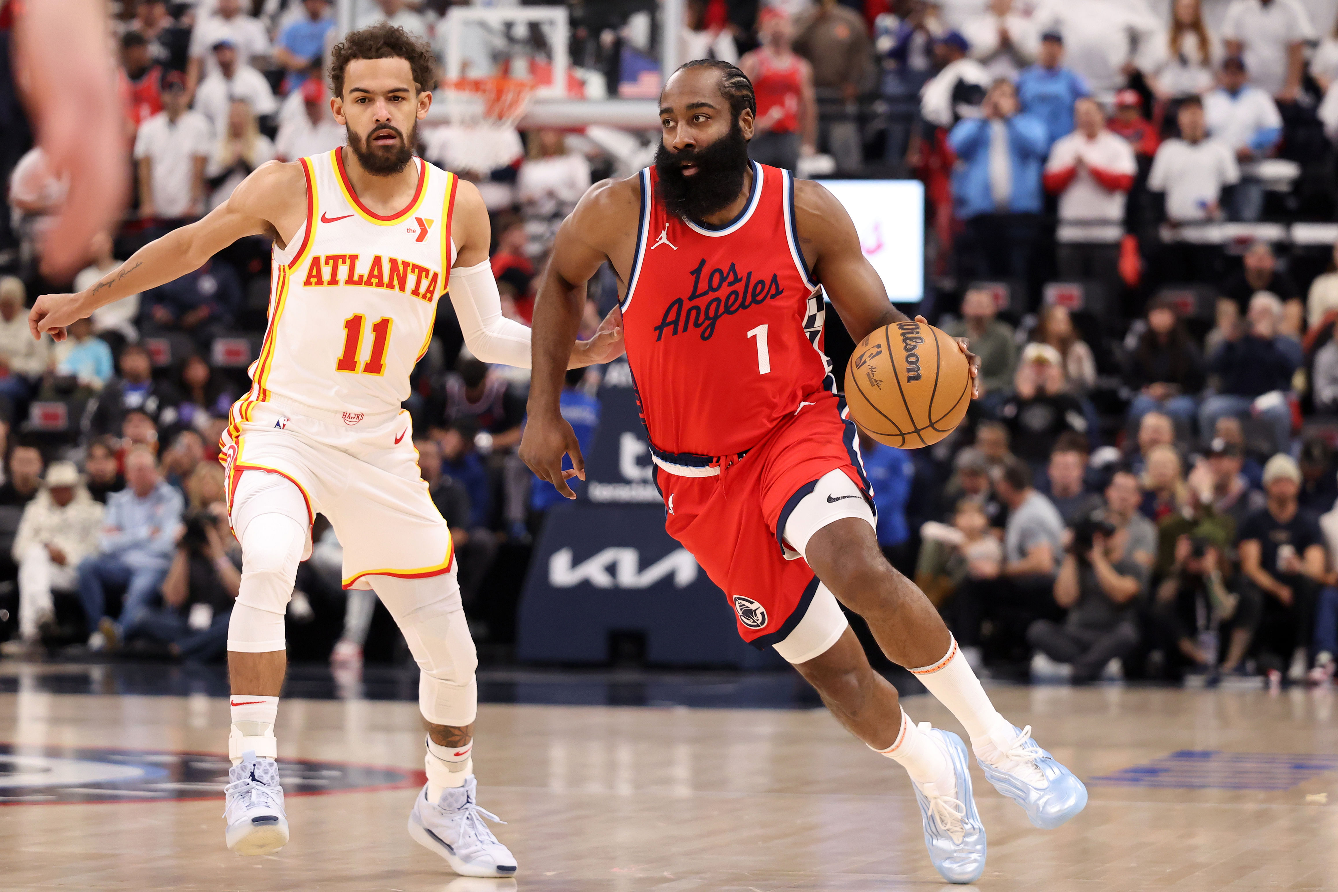 LA Clippers guard James Harden dribbles the ball against Atlanta Hawks guard Trae Young at Intuit Dome. Photo Credit: Imagn