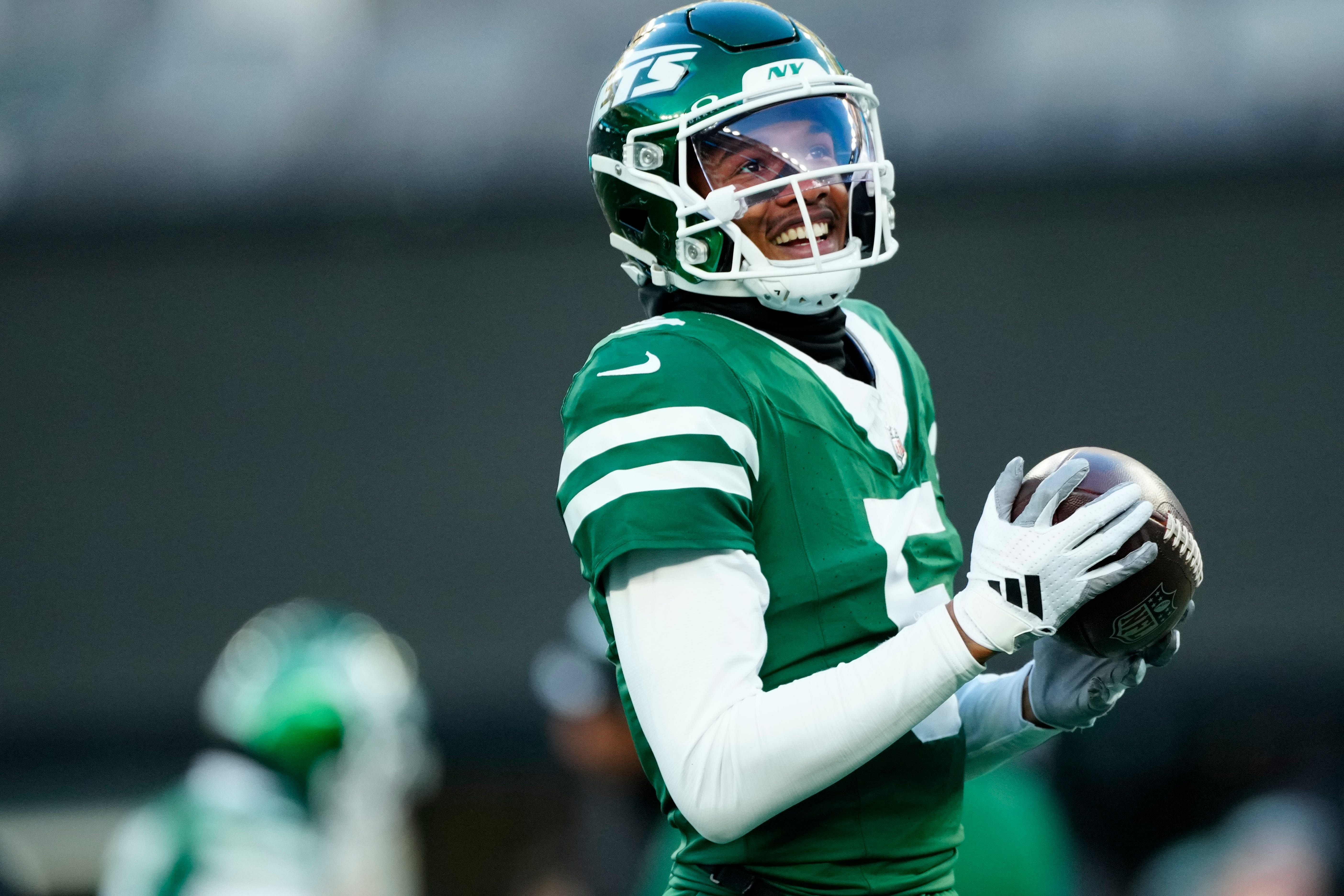 Garrett Wilson holding a football - Source: Imagn