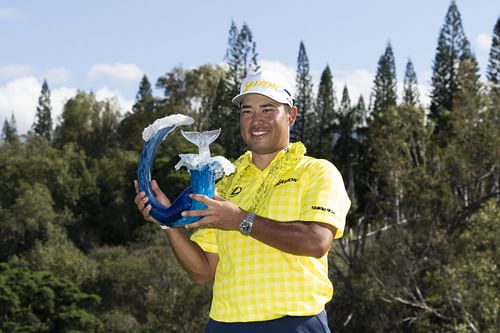 Hideki Matsuyama celebrates with the trophy after winning during the final round of The Sentry 2025 (Image Source: Imagn)