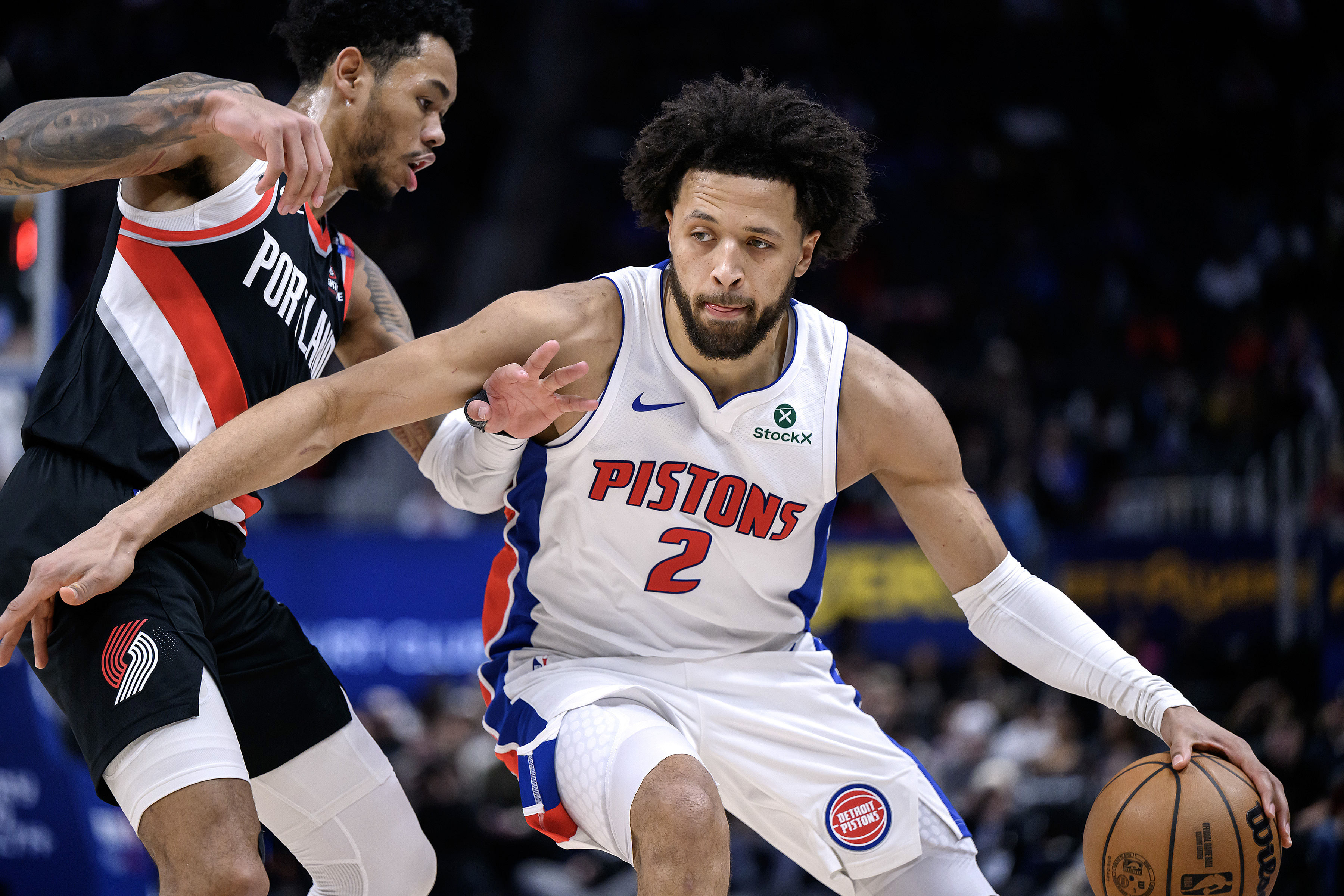 Detroit Pistons guard Cade Cunningham drives past Portland Trail Blazers guard Anfernee Simons at Little Caesars Arena. Photo Credit: Imagn