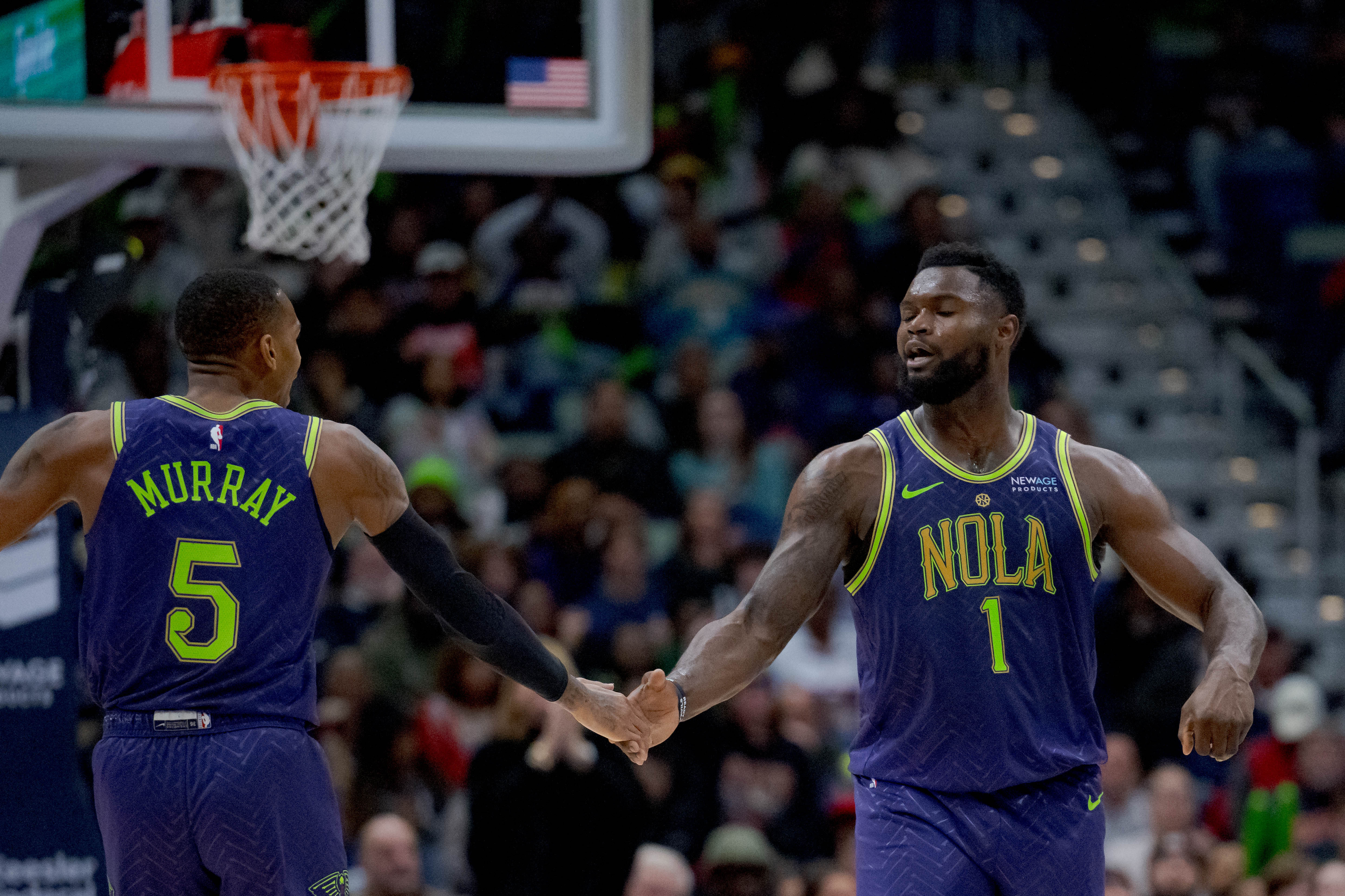 Jan 7, 2025; New Orleans, Louisiana, USA; New Orleans Pelicans guard Dejounte Murray (5) and New Orleans Pelicans forward Zion Williamson (1) celebrate a three-point basket made by Murray with an assist from Williamson during the first half against the Minnesota Timberwolves at Smoothie King Center. Mandatory Credit: Matthew Hinton-Imagn Images - Source: Imagn