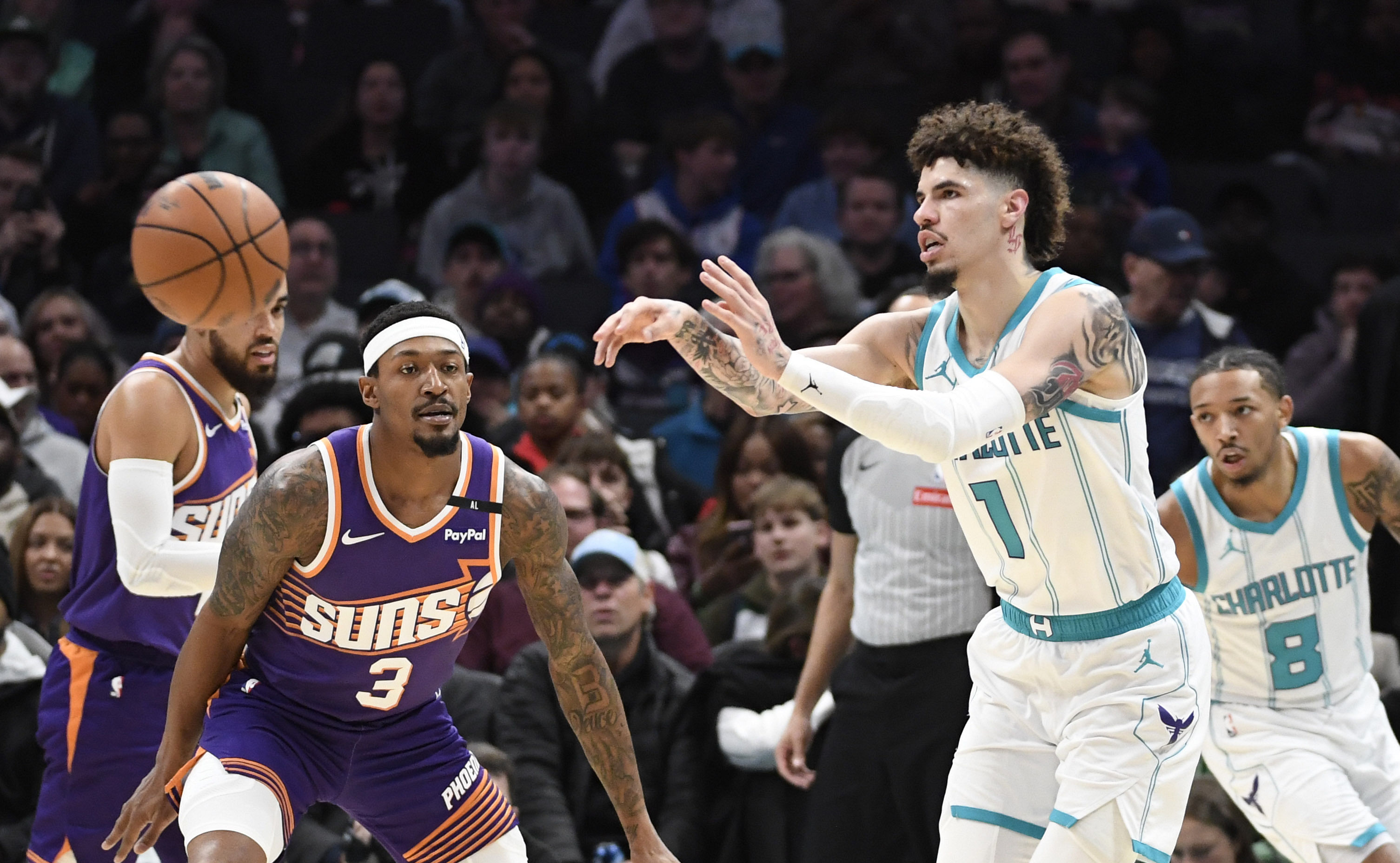 Jan 7, 2025; Charlotte, North Carolina, USA; Charlotte Hornets guard LaMelo Ball (1) passes during the second half against the Phoenix Suns at the Spectrum Center. Mandatory Credit: Sam Sharpe-Imagn Images - Source: Imagn