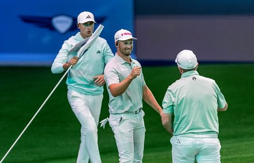 Bay Club golfer Wyndham Clark celebrates with Shane Lowry, right, with Ludvig Aberg behind him during a TGL match at SoFi Center (Image Source: Imagn)