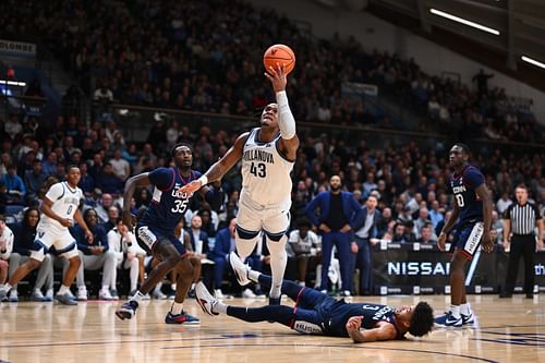 Villanova Wildcats forward Eric Dixon (#43) drives to shoot against the UConn Huskies in the second half of their NCAA basketball game at William B. Finneran Pavilion (Credits: Imagn)