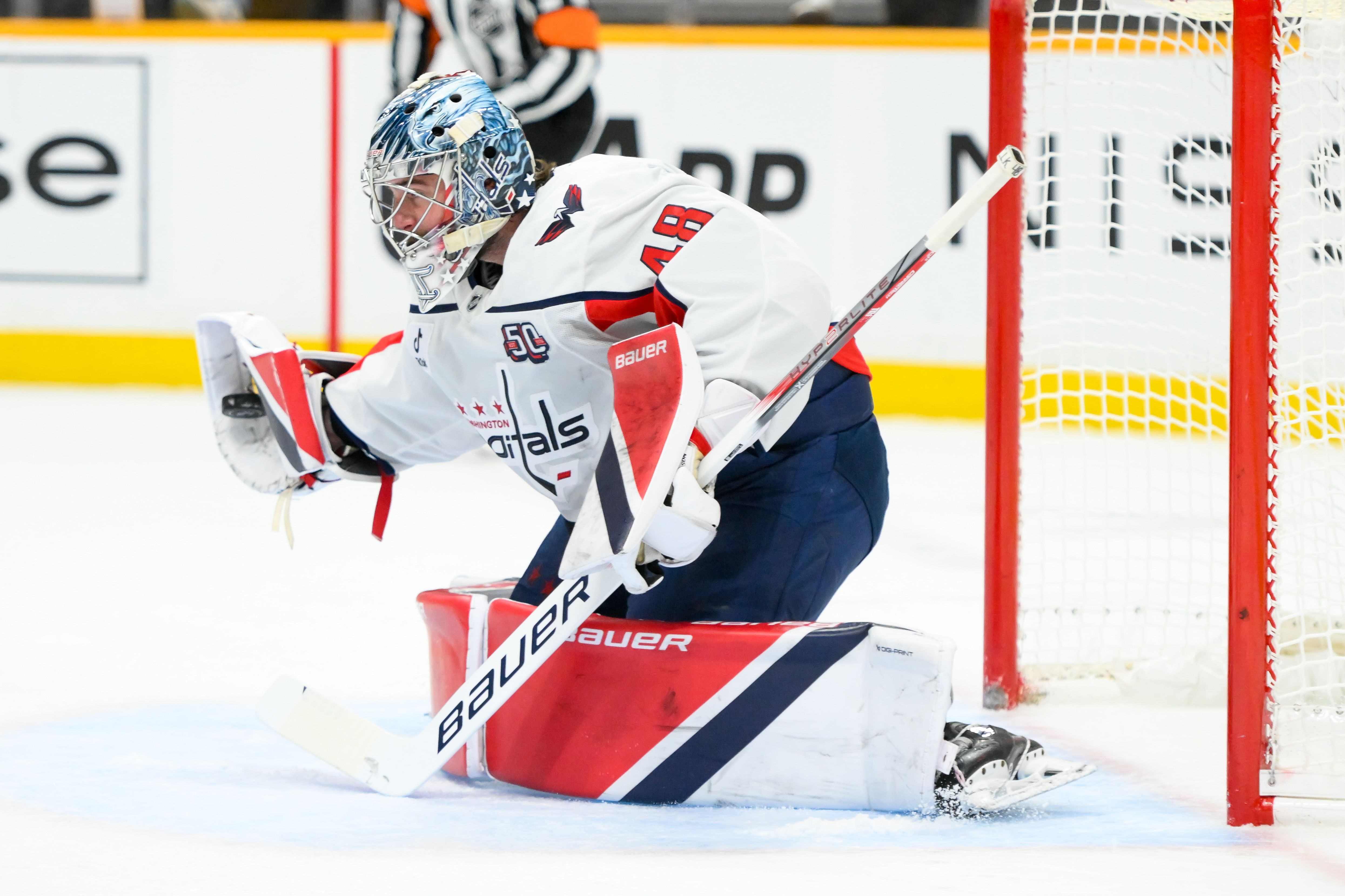 Washington Capitals goaltender Logan Thompson (48) makes a glove save during an NHL game. (Credits: IMAGN)