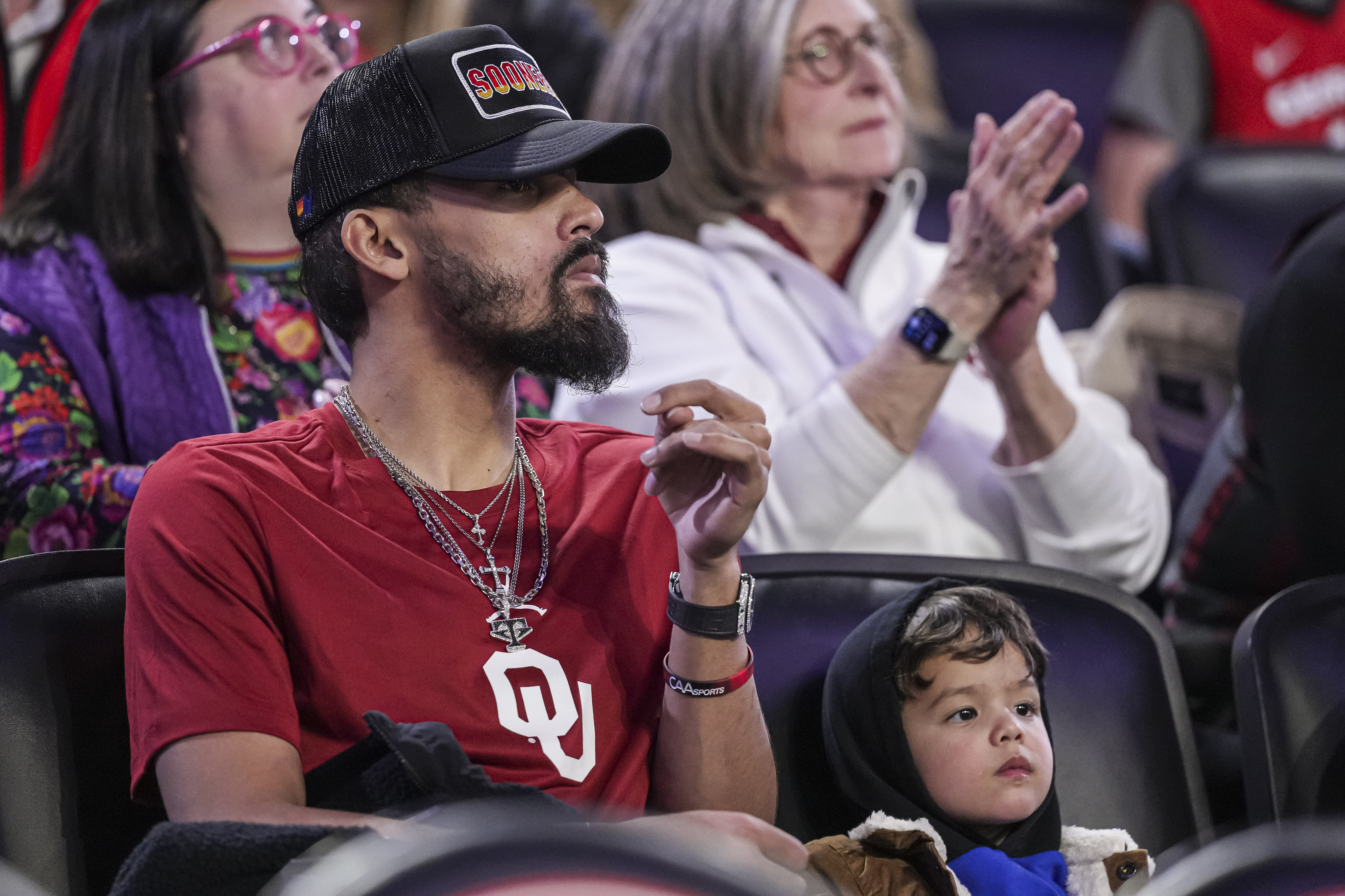 Jan 11, 2025; Athens, Georgia, USA; Atlanta Hawks player Trae Young with his son Tydus watch the game between the Georgia Bulldogs and the Oklahoma Sooners at Stegeman Coliseum. Mandatory Credit: Dale Zanine-Imagn Images - Source: Imagn