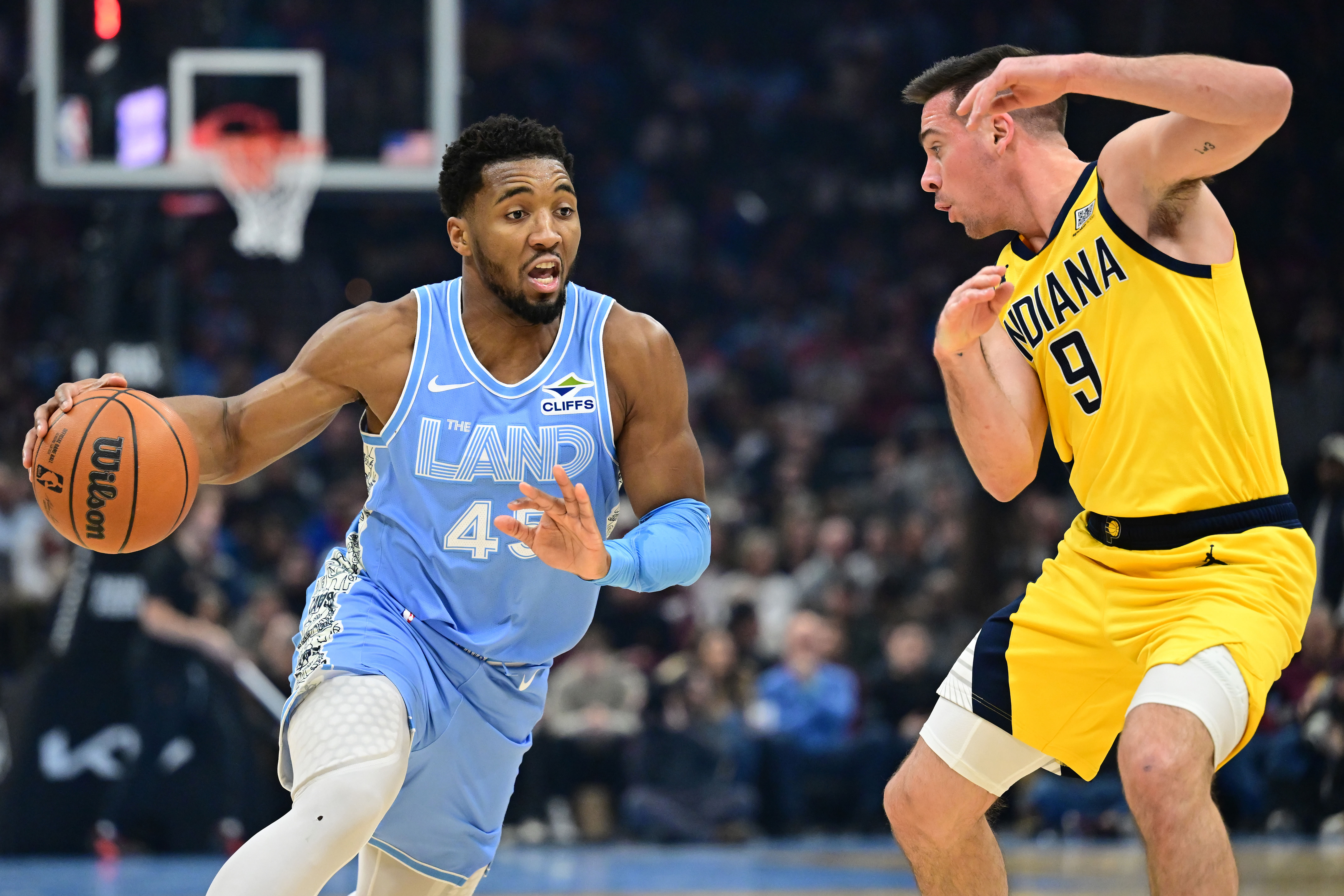 Cleveland Cavaliers guard Donovan Mitchell drives to the basket against Indiana Pacers guard T.J. McConnell at Rocket Mortgage FieldHouse. Photo Credit: Imagn