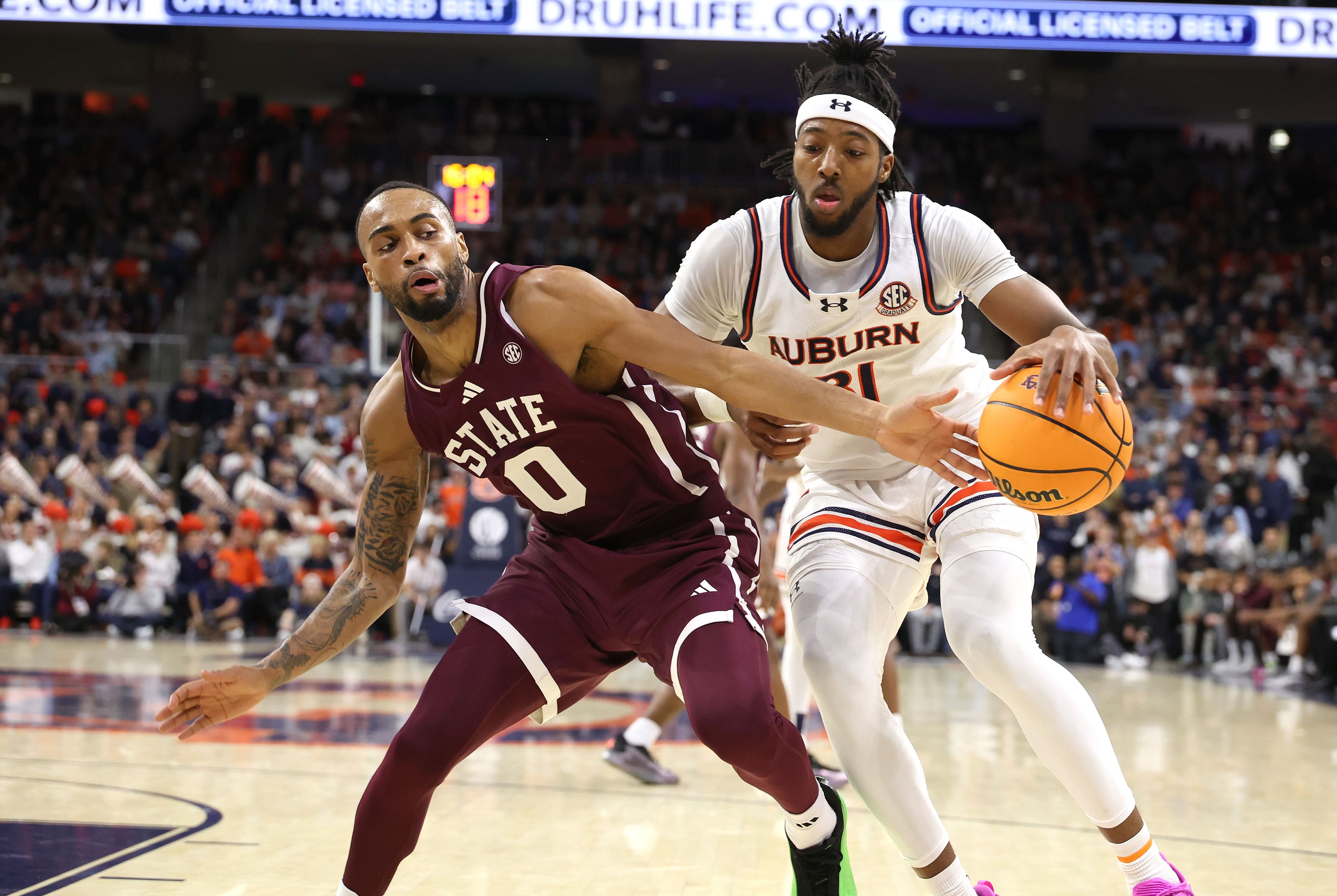 NCAA Basketball: Jan 14, 2025; Mississippi State Bulldogs guard Claudell Harris Jr. and Auburn Tigers forward Chaney Johnson - Source: Image via Imagn