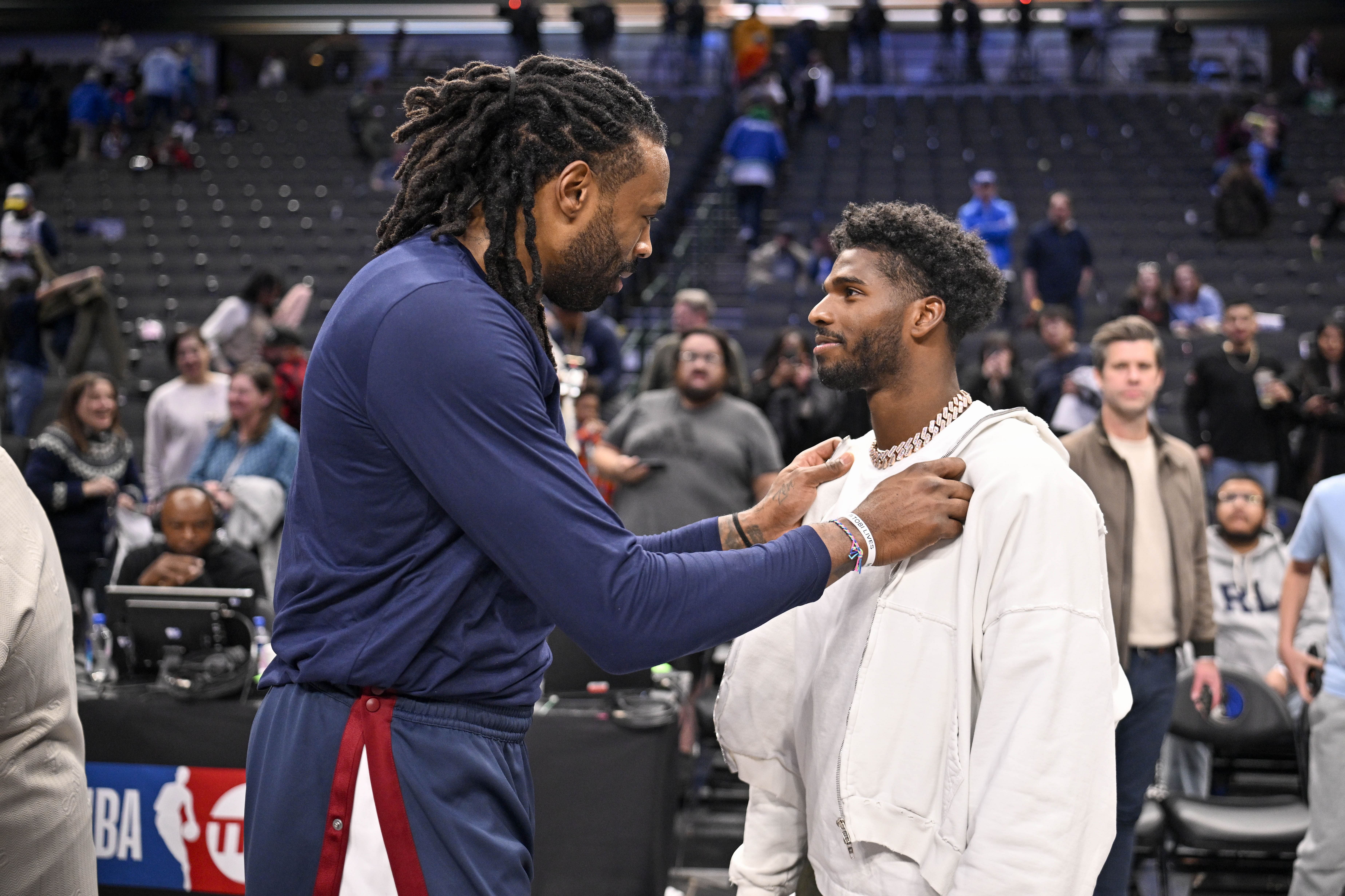 Nuggets center DeAndre Jordan (left) talks with Colorado Buffaloes quarterback Shedeur Sanders - Source: Imagn