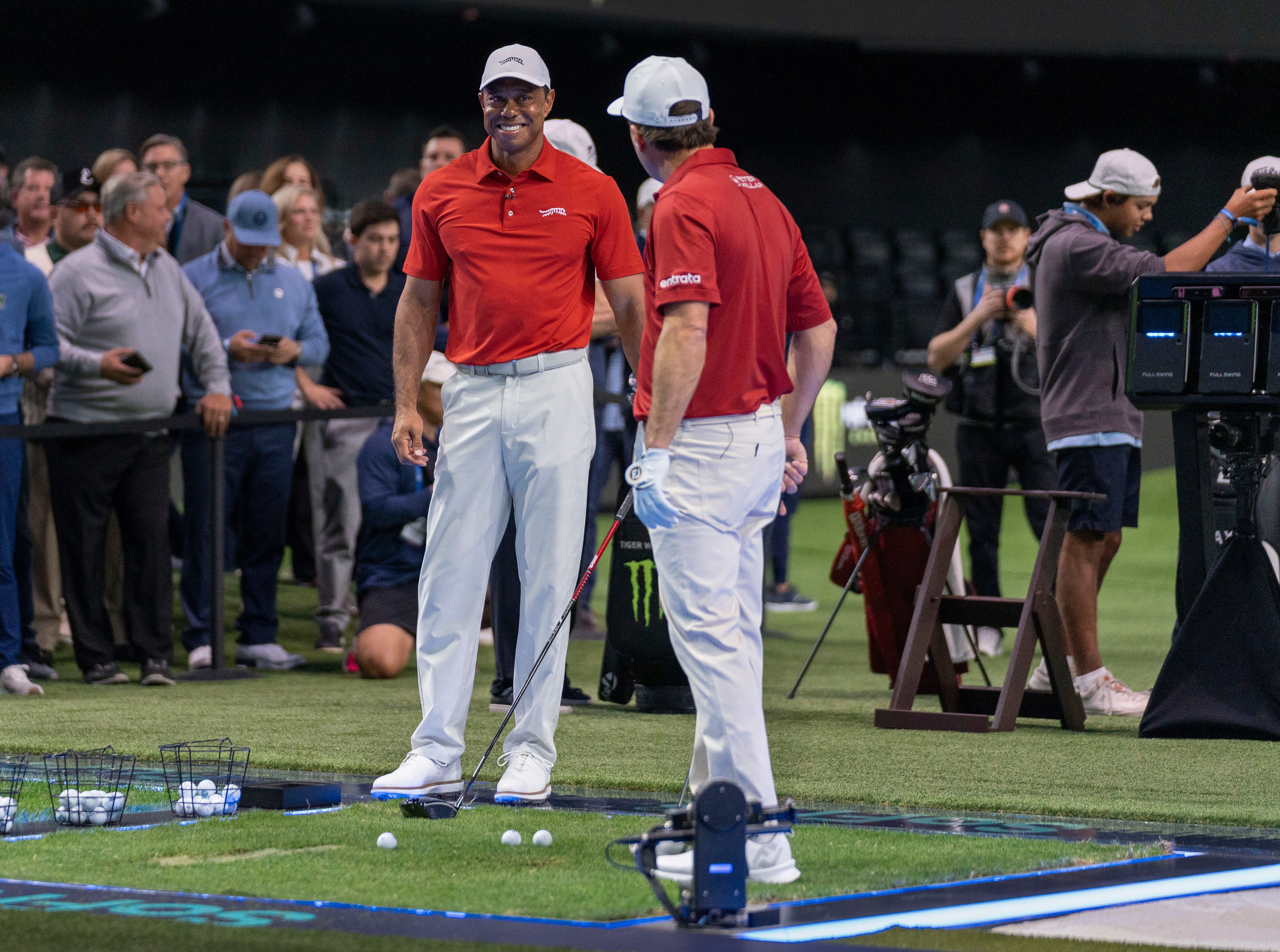 Tiger Woods and Kevin Kisner warm up at SoFi Center before the golf match between Jupiter Links and Los Angeles Golf Club in the TGL - Source: Imagn