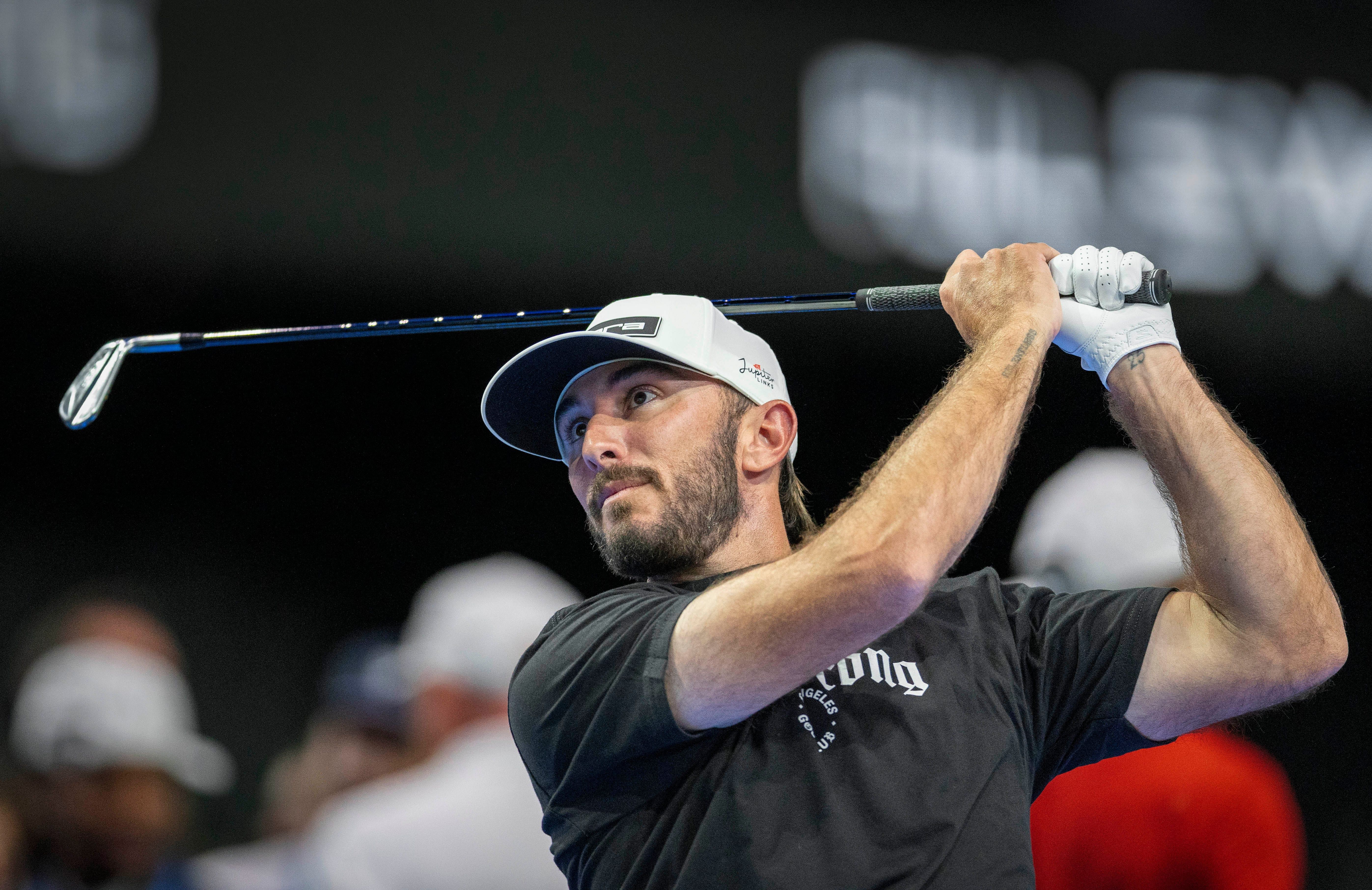 Max Homa hits the ball at SoFi Center during a golf match between Jupiter Links Golf Club and Los Angeles Golf Club in the TGL (Image Source: Imagn)