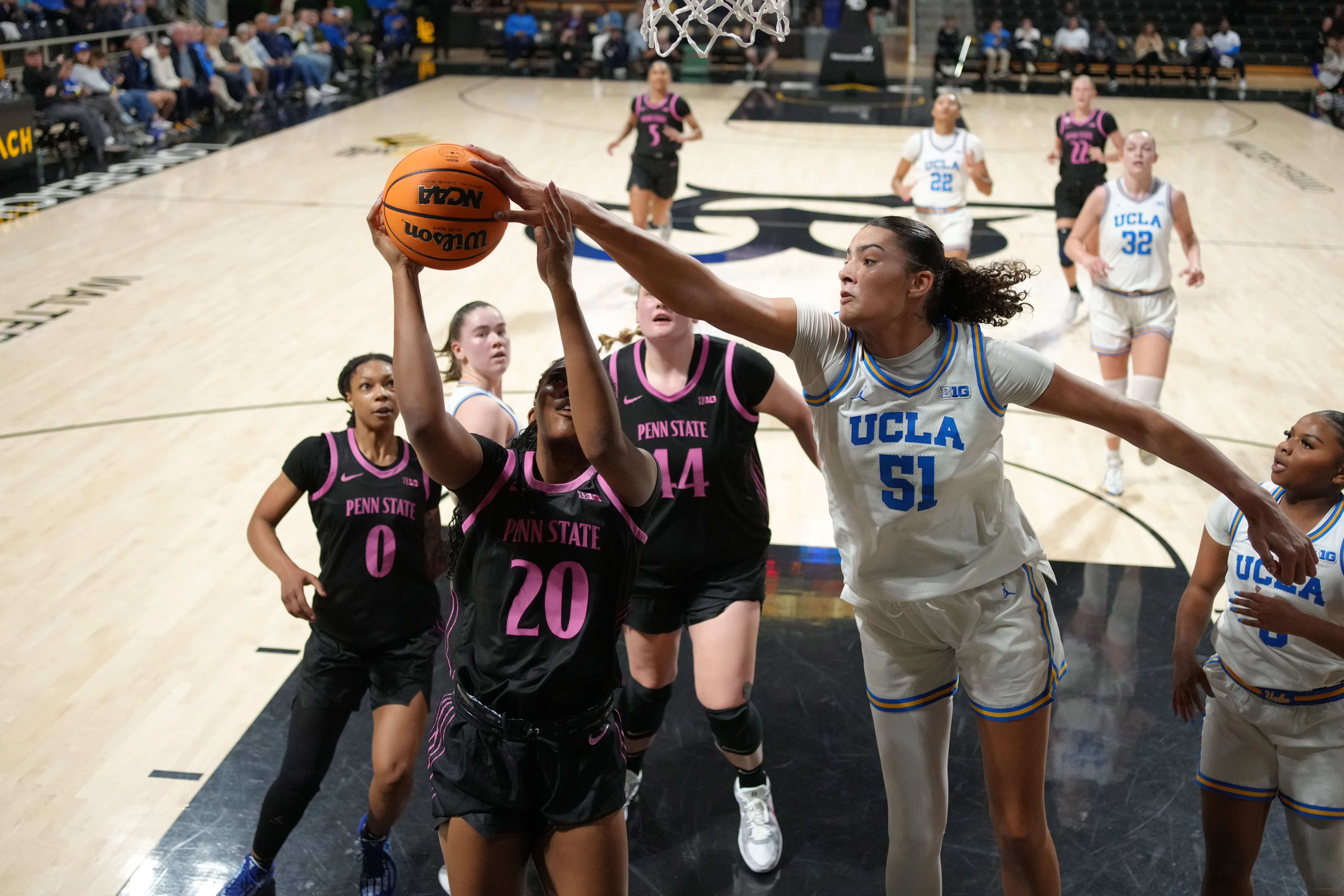 UCLA Bruins center Lauren Betts (#51) blocks a shot by Penn State Nittany Lions guard Talayah Walker (20) in the first half at the Walter Pyramid at Long Beach State. Photo: Imagn