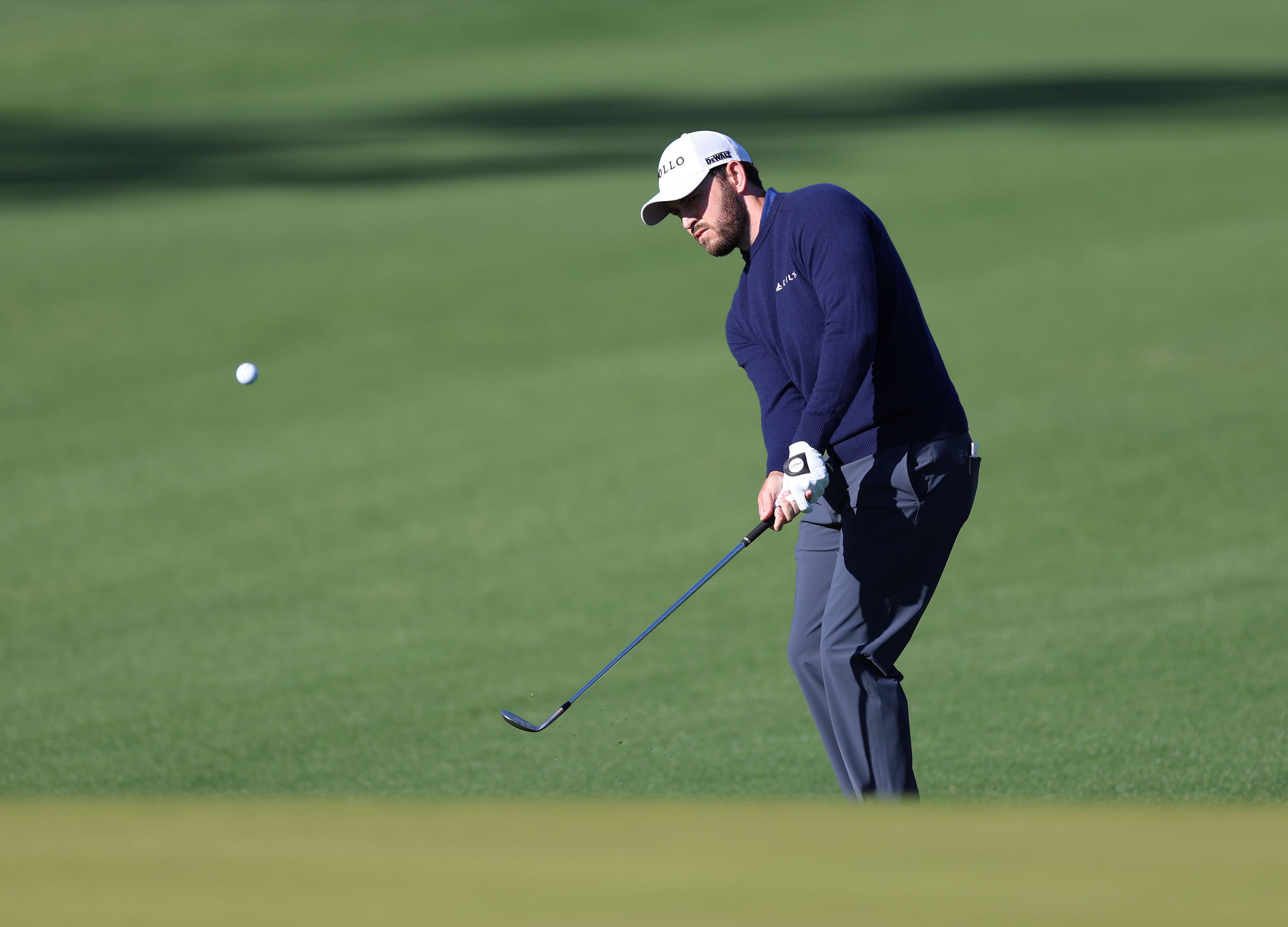 Patrick Cantlay chips on to the fifth green during the first round of the American Express 2025 at La Quinta Country Club (Image Source: Imagn)