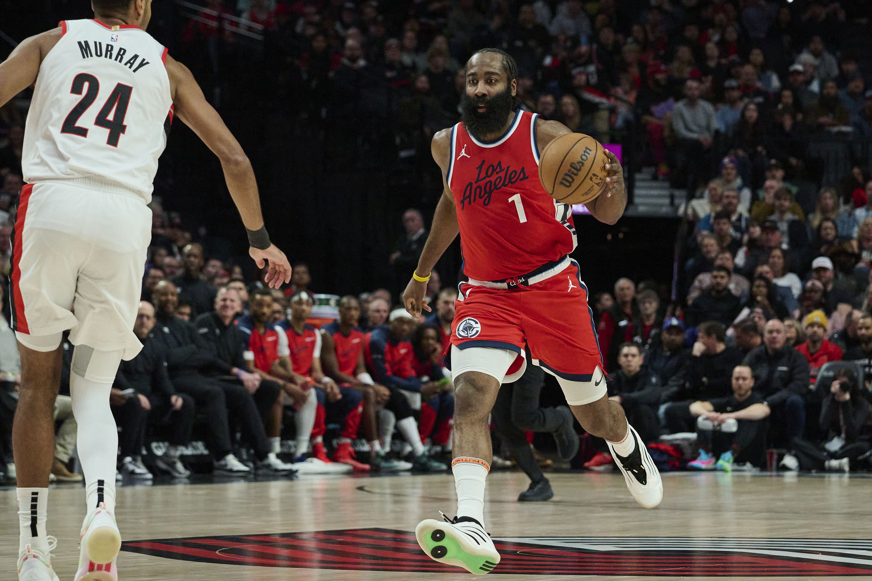 LA Clippers guard James Harden dribbles the ball against Portland Trail Blazers forward Kris Murray at Moda Center. Photo Credit: Imagn