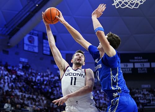 Creighton Bluejays center Ryan Kalkbrenner (#11) blocks the shot of UConn Huskies forward Alex Karaban (#11) in the first half at Harry A. Gampel Pavilion. Photo: Imagn