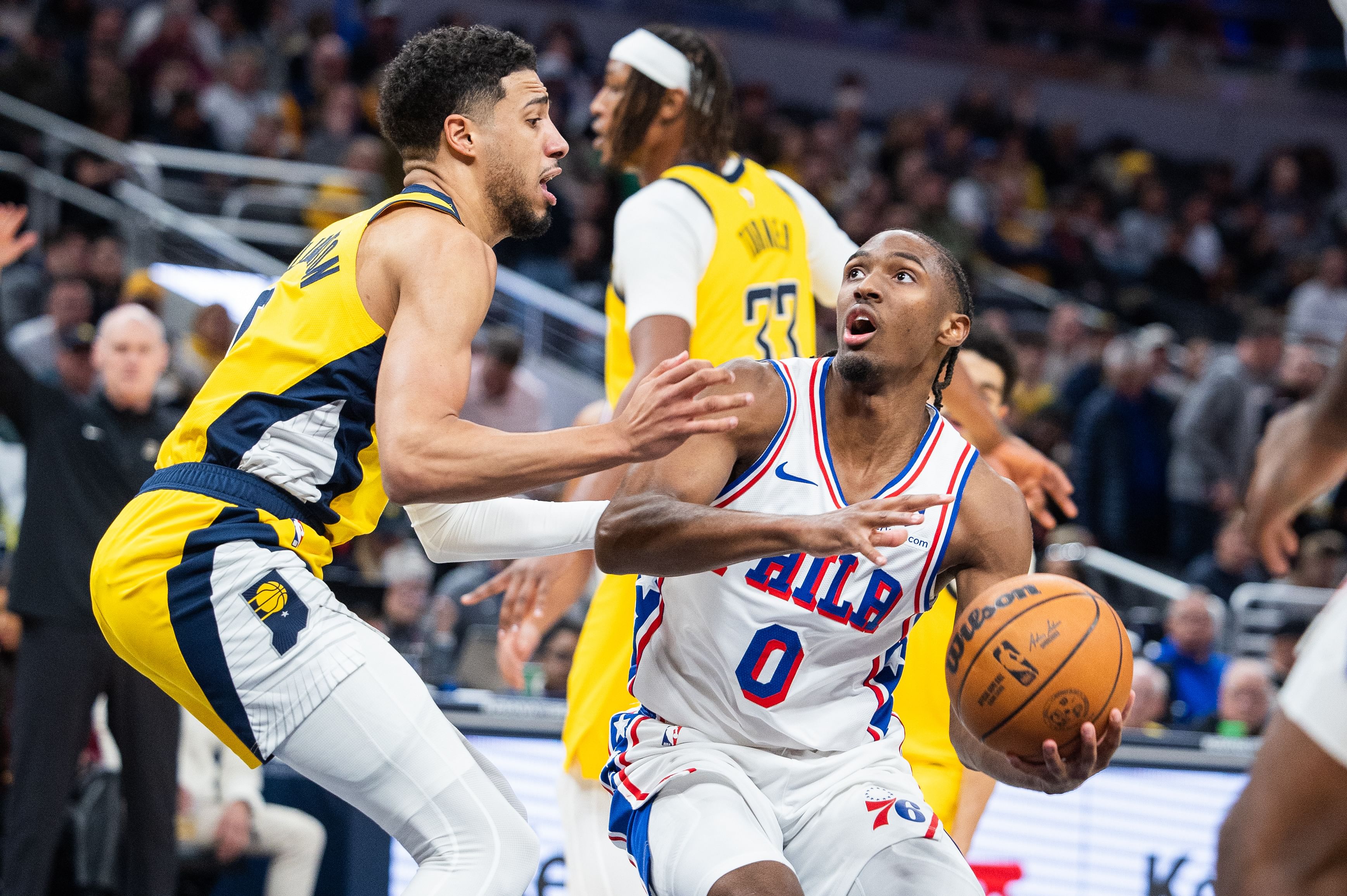 Jan 18, 2025; Indianapolis, Indiana, USA; Philadelphia 76ers guard Tyrese Maxey (0) shoots the ball while Indiana Pacers guard Tyrese Haliburton (0) defends in the second half at Gainbridge Fieldhouse. Mandatory Credit: Trevor Ruszkowski-Imagn Images - Source: Imagn