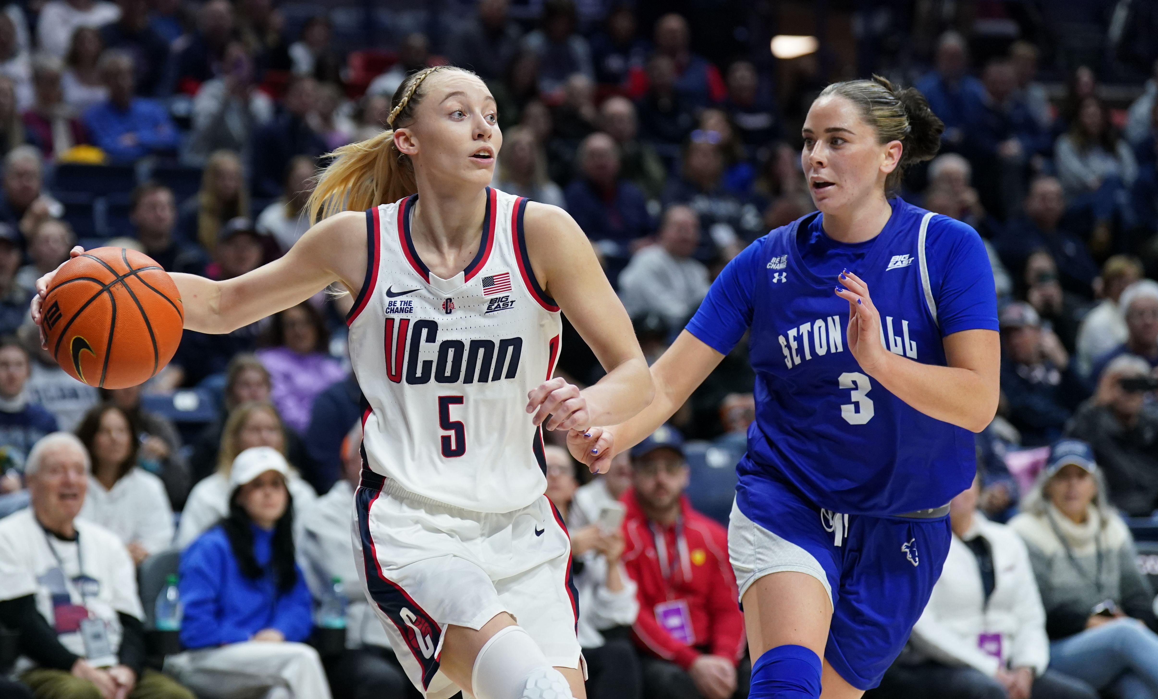 UConn Huskies guard Paige Bueckers (#5) attacks the defense of Seton Hall Pirates forward Faith Masonius (#3) in the first half at Harry A. Gampel Pavilion. Photo: Imagn