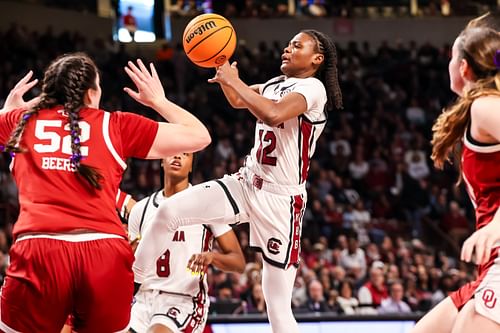 South Carolina Gamecocks guard MiLaysia Fulwiley (#12) drives over Oklahoma Sooners center Raegan Beers (#52) in the first half at Colonial Life Arena. Photo: Imagn