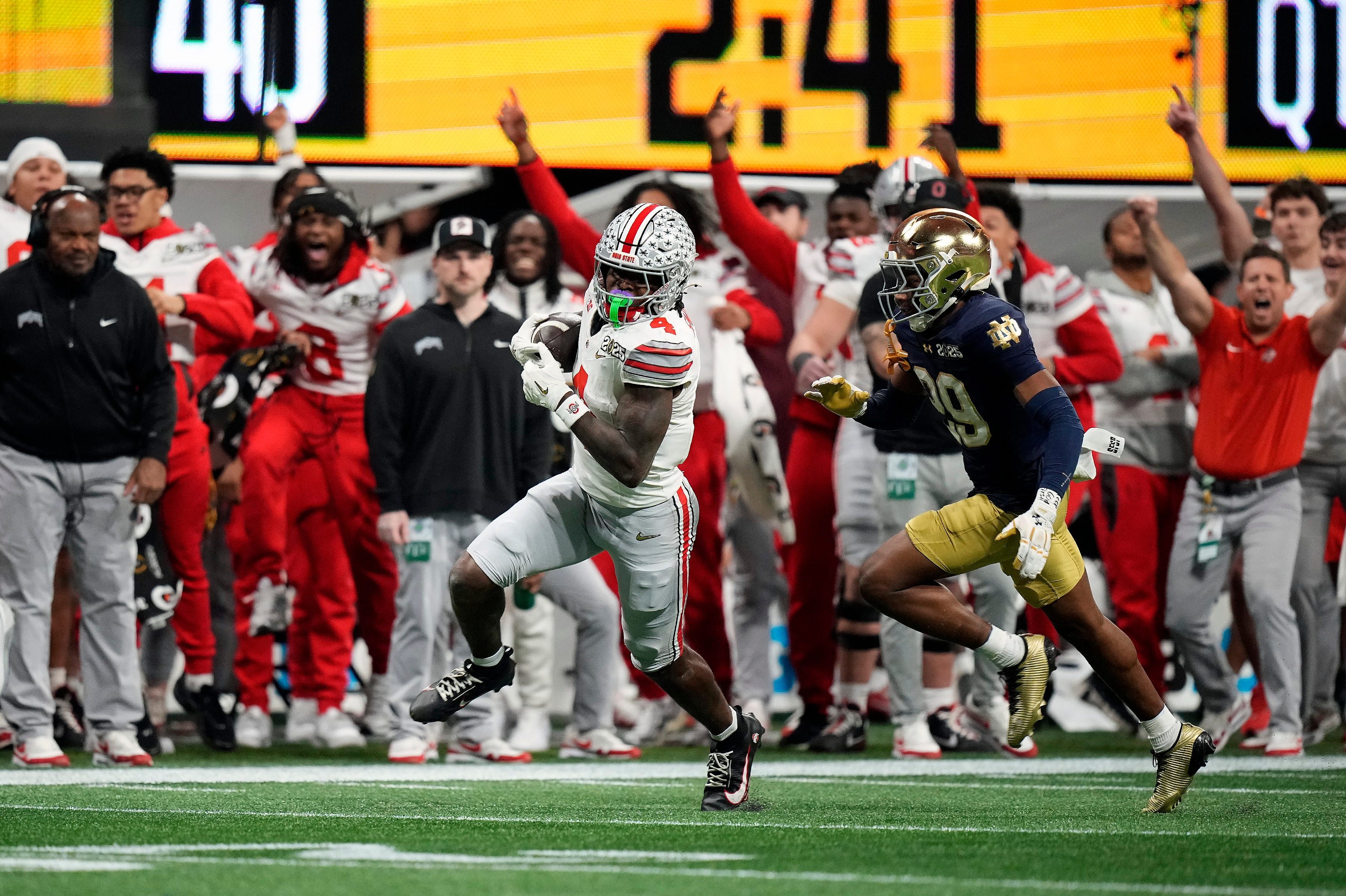 Ohio State Buckeyes wide receiver Jeremiah Smith (4) makes a catch against Notre Dame Fighting Irish cornerback Christian Gray (29) - Source: Imagn