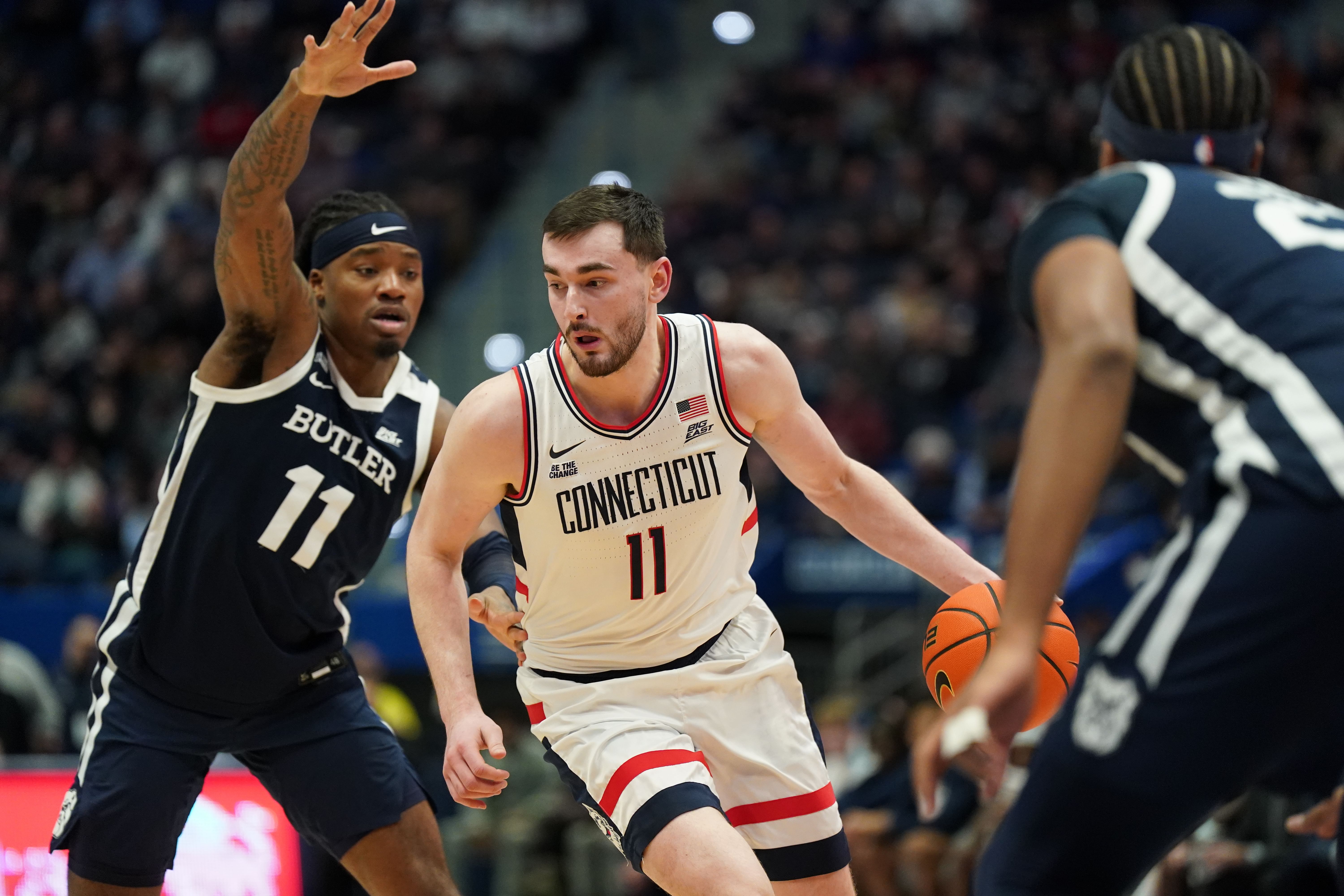 UConn Huskies forward Alex Karaban (#11) drives the ball against Butler Bulldogs forward Jahmyl Telfort (#11) in the first half. Photo: Imagn