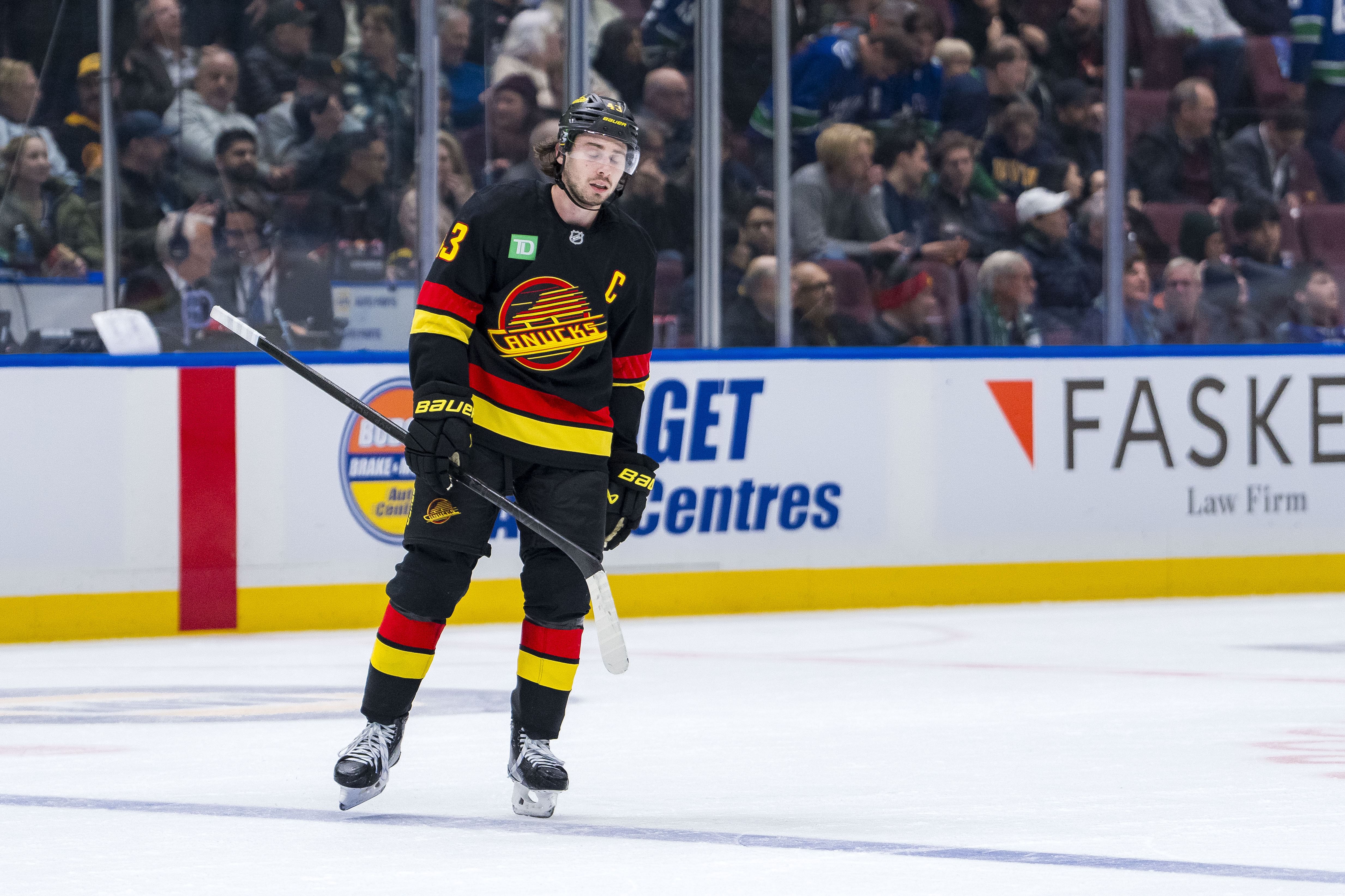 Jan 21, 2025; Vancouver, British Columbia, CAN; Dejected Vancouver Canucks defenseman Quinn Hughes (43) skates off the ice at the end of a game against the Buffalo Sabres at Rogers Arena. Mandatory Credit: Bob Frid-Imagn Images - Source: Imagn