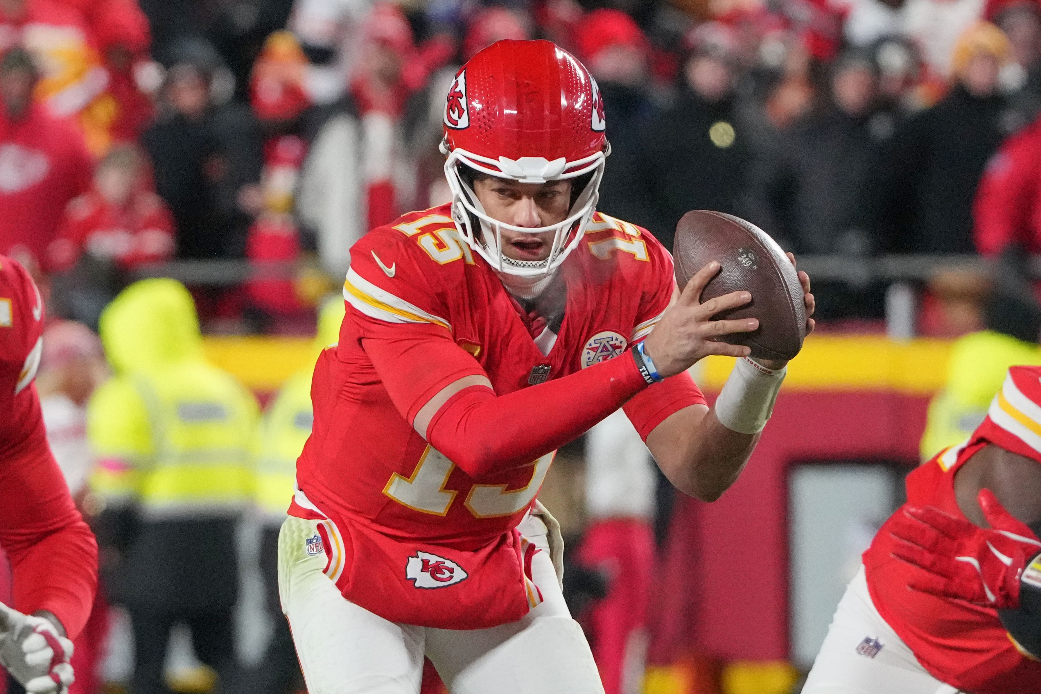 Kansas City Chiefs quarterback Patrick Mahomes (15) takes a snap against the Houston Texans during the second half of their 2025 AFC divisional round game. (Credits: IMAGN)