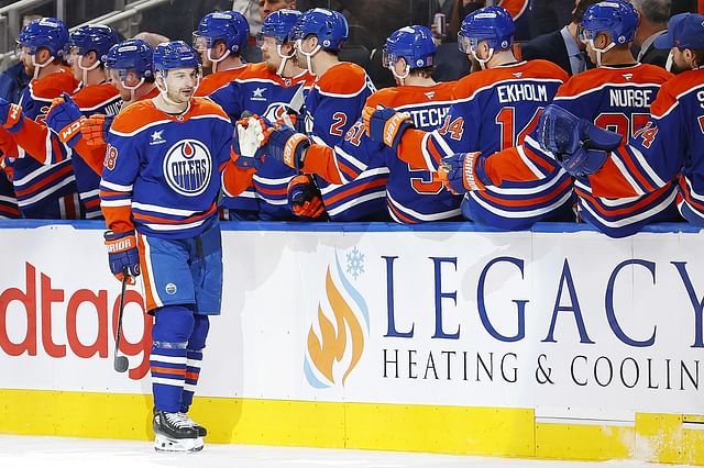 Jan 23, 2025; Edmonton, Alberta, CAN; Edmonton Oilers forward Zach Hyman (18) celebrates after scoring a goal against the Vancouver Canucks at Rogers Place. Mandatory Credit: Perry Nelson-Imagn Images - Source: Imagn