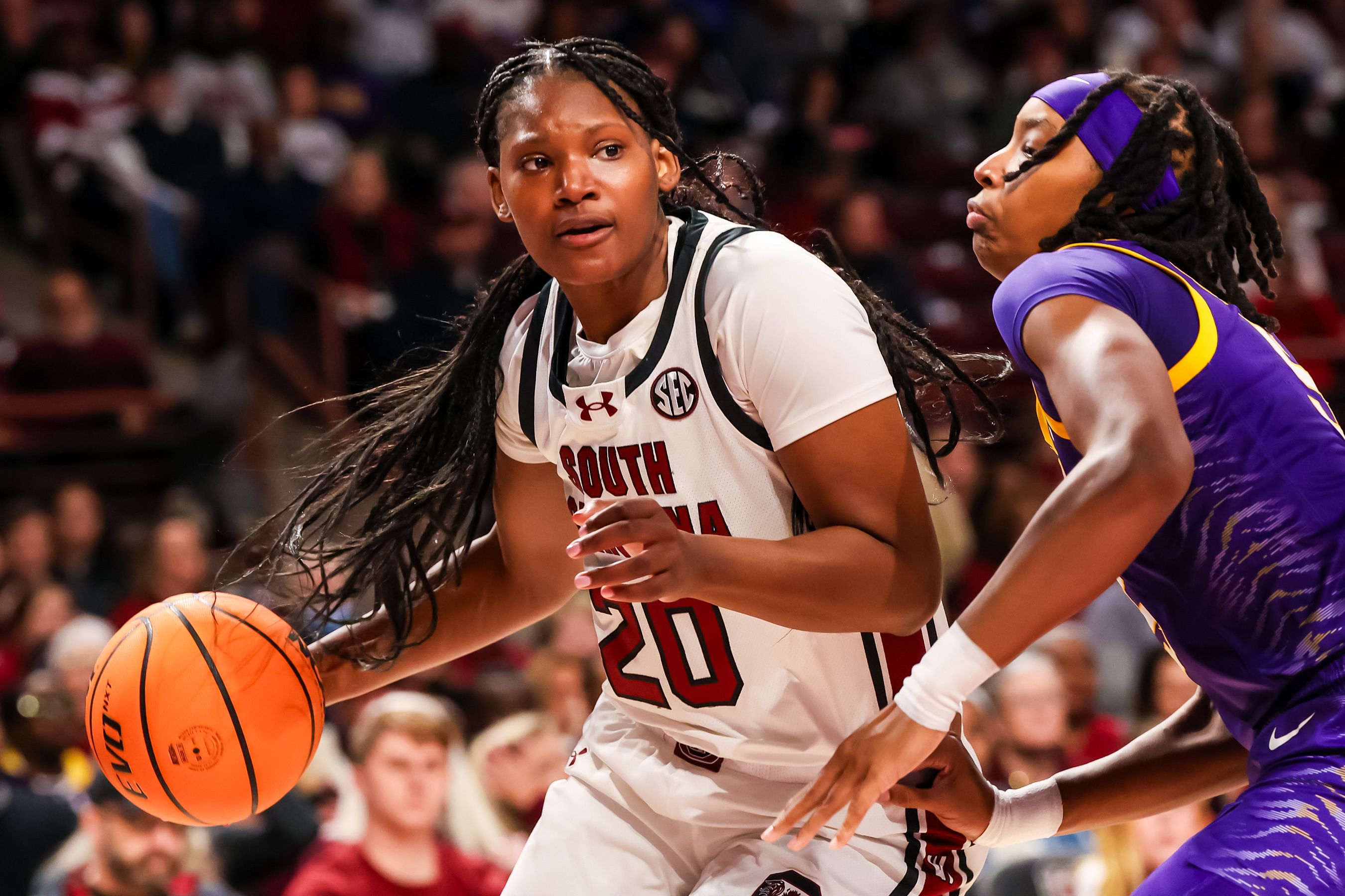 South Carolina Gamecocks forward Sania Feagin (#20) drives around LSU Tigers forward Sa&#039;Myah Smith (#5) in the first half at Colonial Life Arena. Photo: Imagn