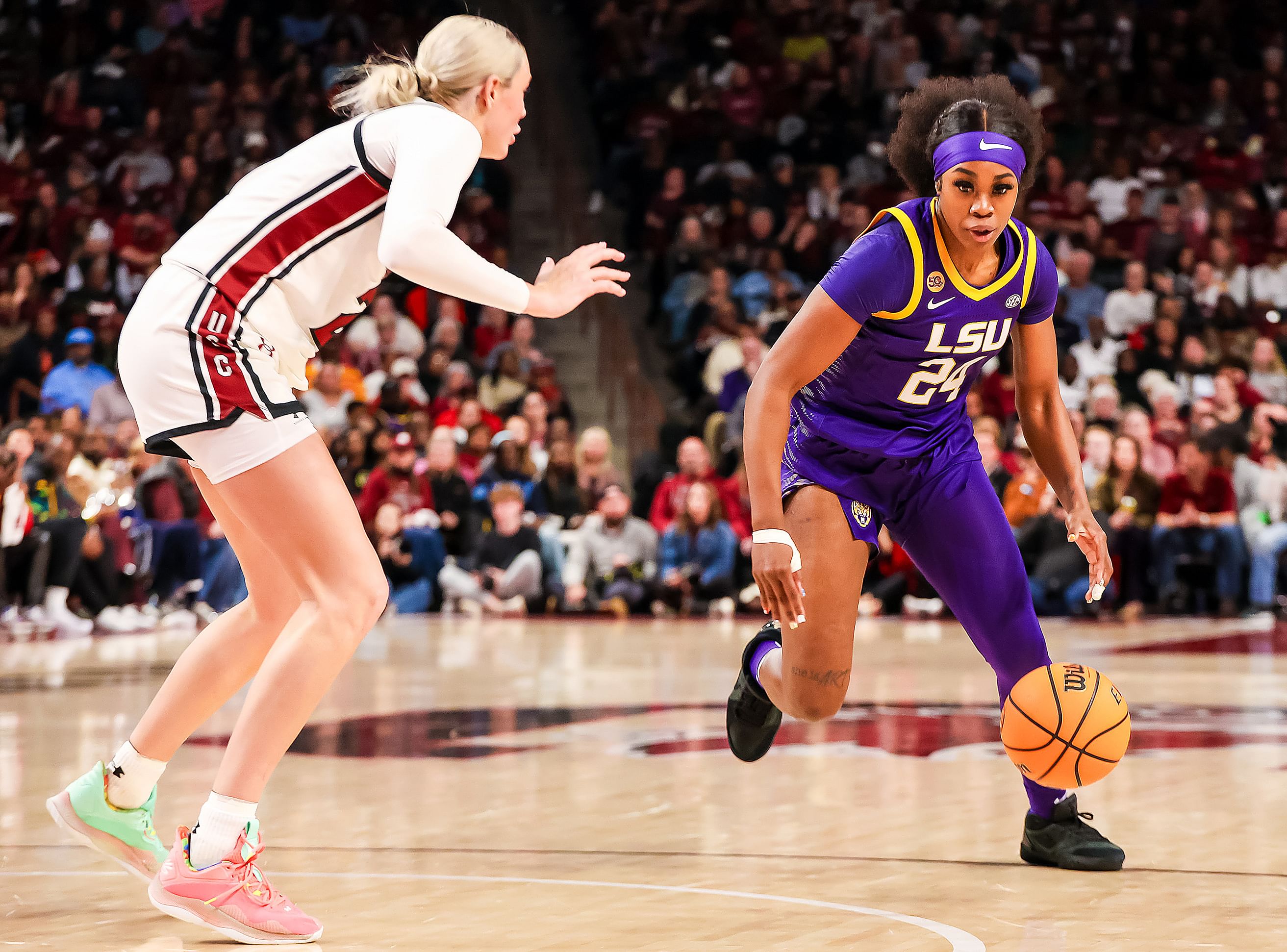 LSU Tigers guard Aneesah Morrow (#24) drives around South Carolina Gamecocks forward Chloe Kitts (#21) in the second half at Colonial Life Arena. Photo: Imagn