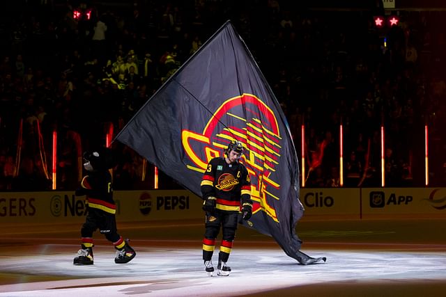 Jan 25, 2025; Vancouver, British Columbia, CAN; Vancouver Canucks defenseman Quinn Hughes (43) skates as the first star of the game against the Washington Capitals at Rogers Arena. Mandatory Credit: Bob Frid-Imagn Images - Source: Imagn